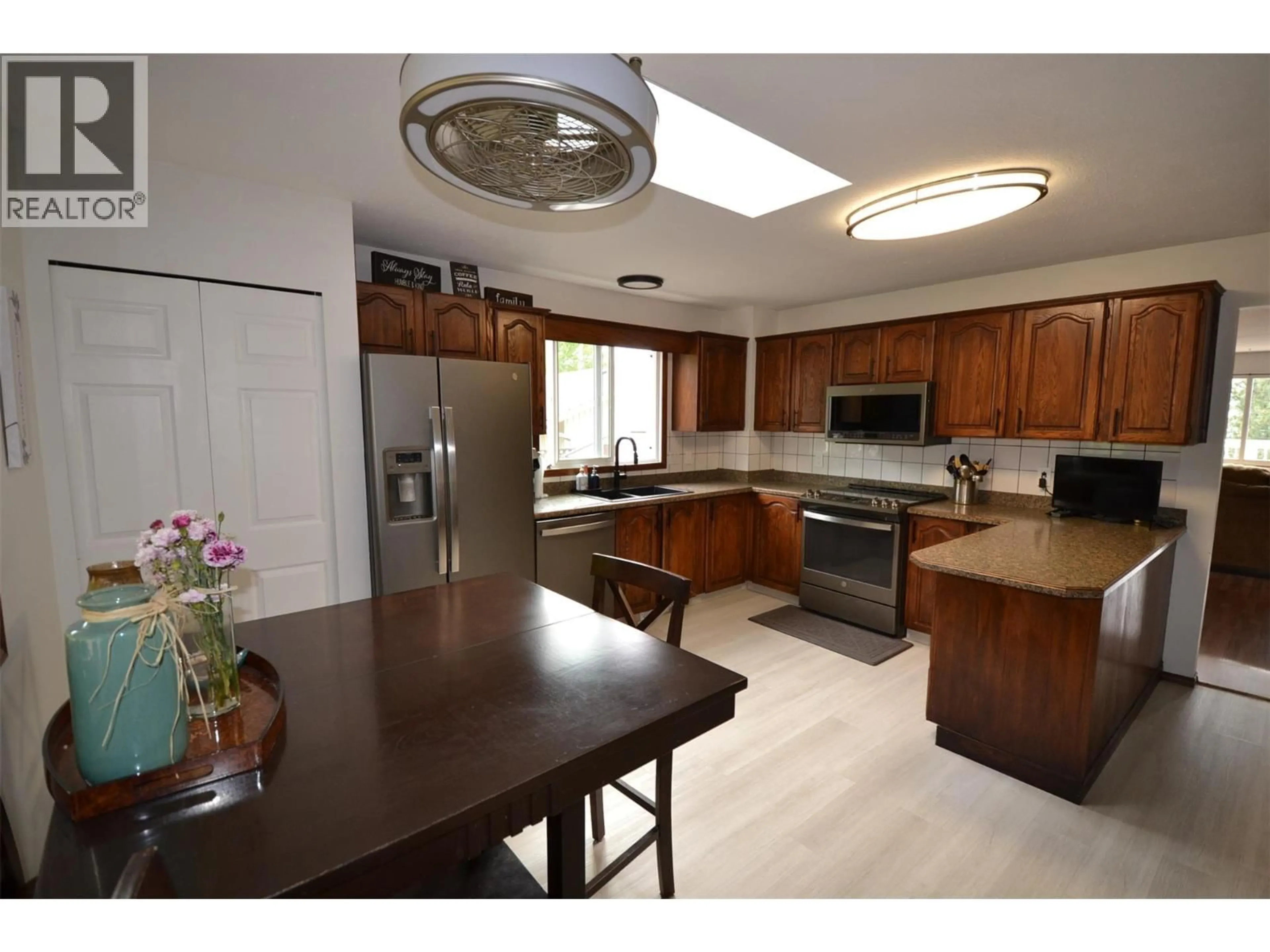 Open concept kitchen, unknown for 3944 TREPANIER HEIGHTS AVENUE, Peachland British Columbia V0H1X2