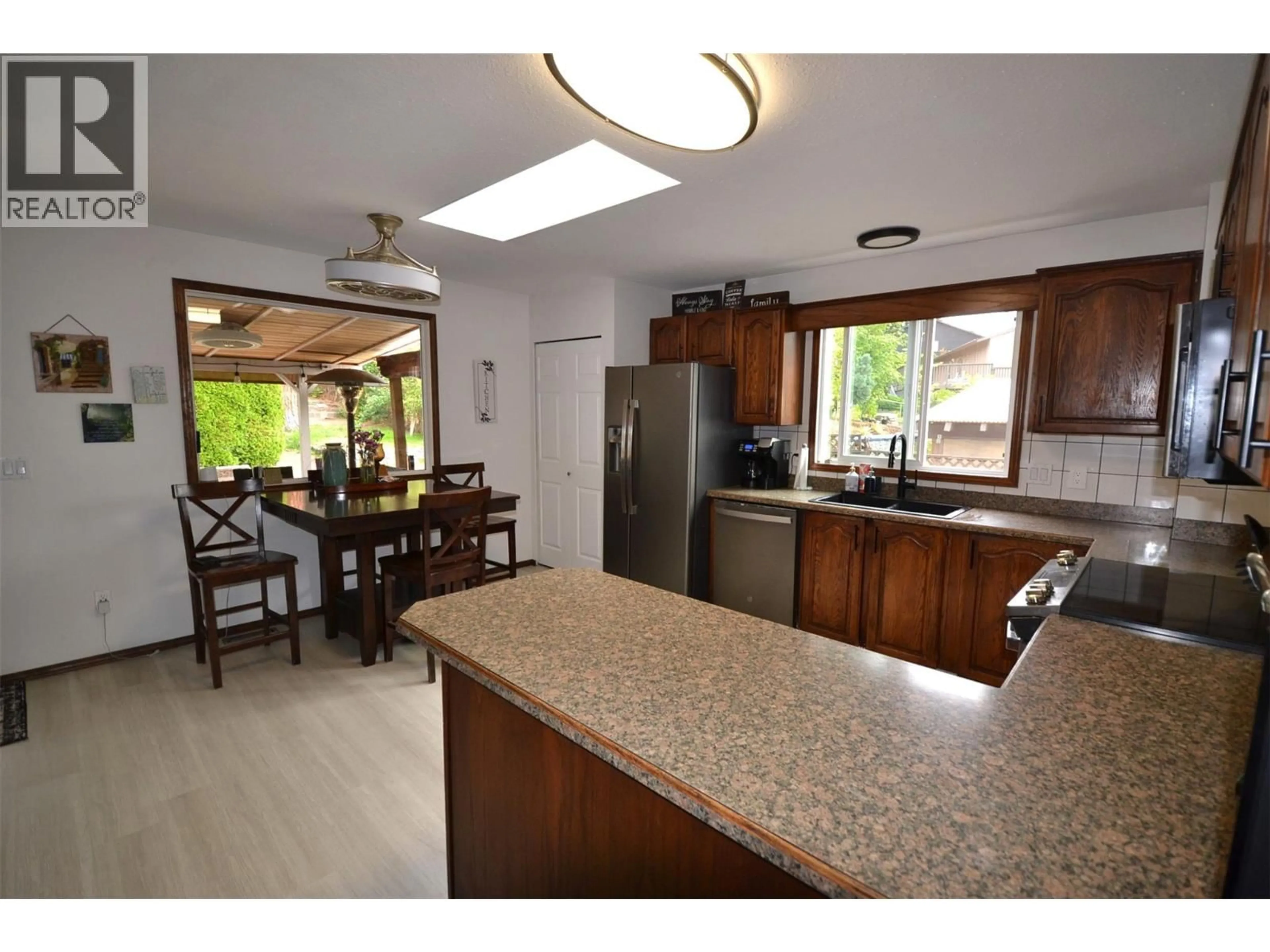 Open concept kitchen, ceramic/tile floor for 3944 TREPANIER HEIGHTS AVENUE, Peachland British Columbia V0H1X2