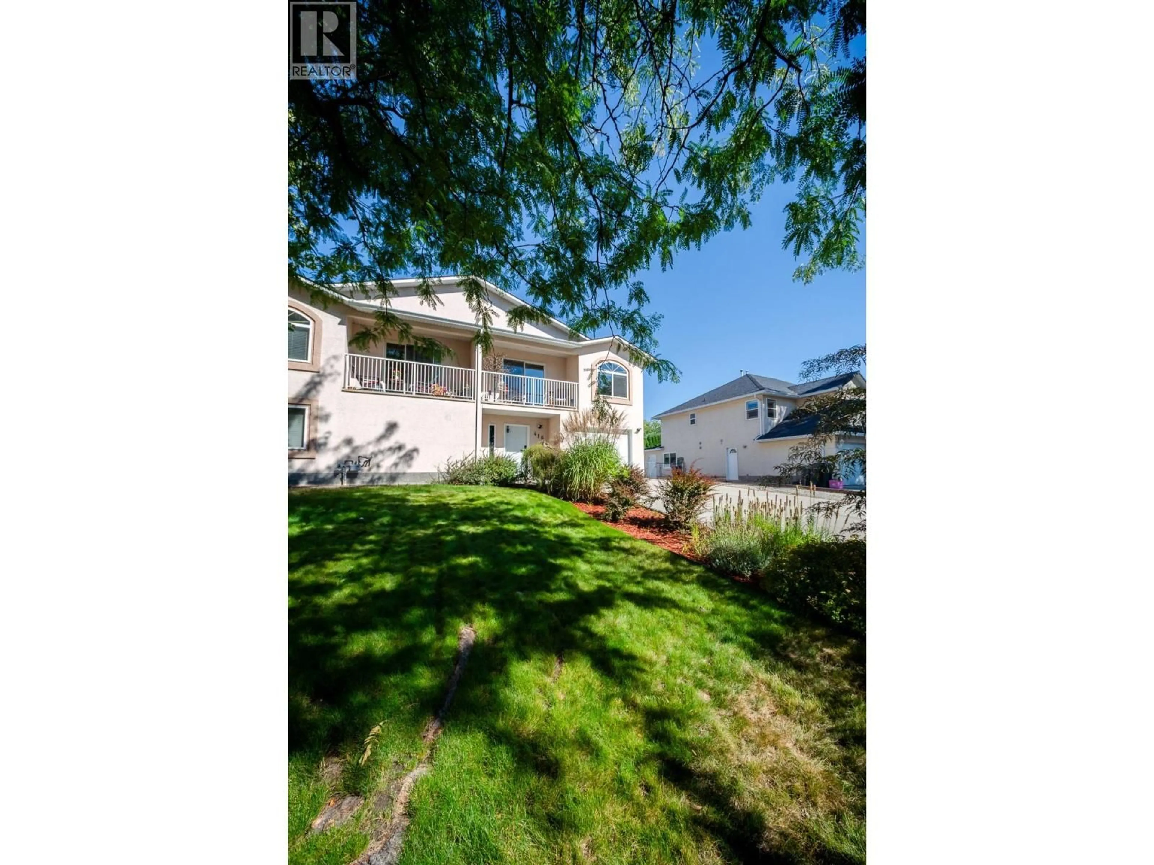 A pic from outside/outdoor area/front of a property/back of a property/a pic from drone, street for 416 SUMAC ROAD EAST, Kelowna British Columbia V1X7N2