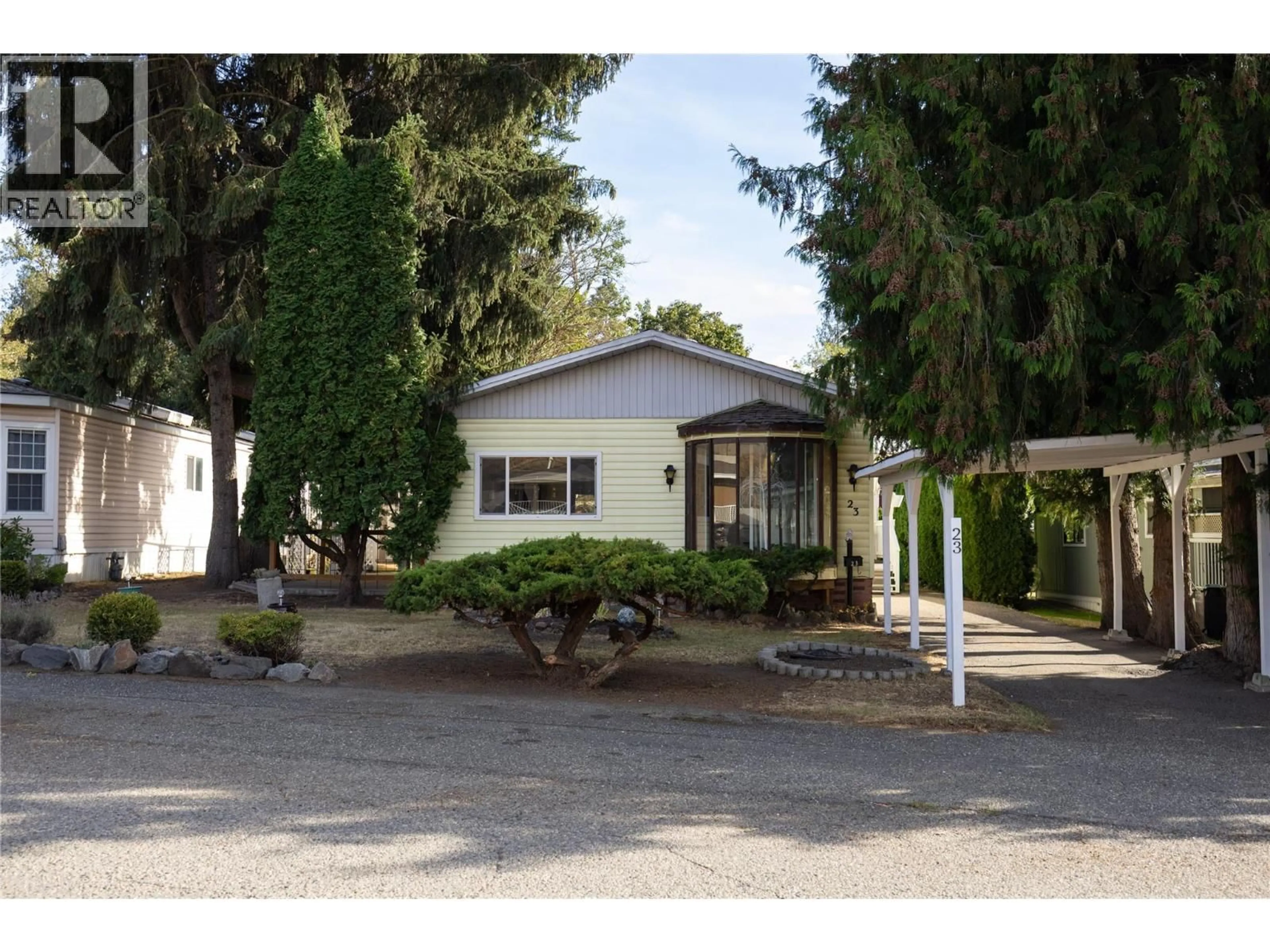 Home with vinyl exterior material, street for 23 - 4701 PLEASANT VALLEY ROAD, Vernon British Columbia V1T4M7