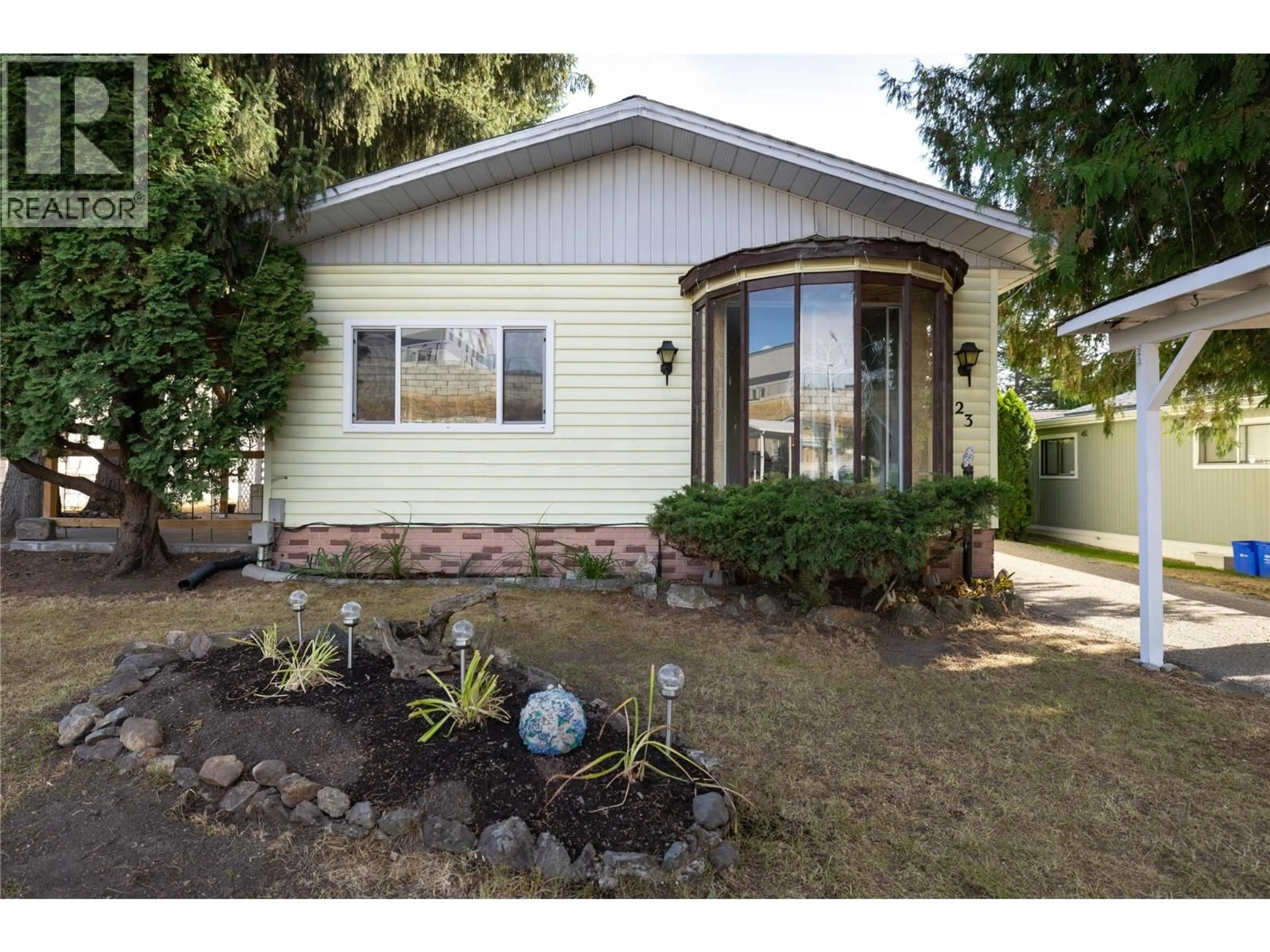Home with vinyl exterior material, street for 23 - 4701 PLEASANT VALLEY ROAD, Vernon British Columbia V1T4M7