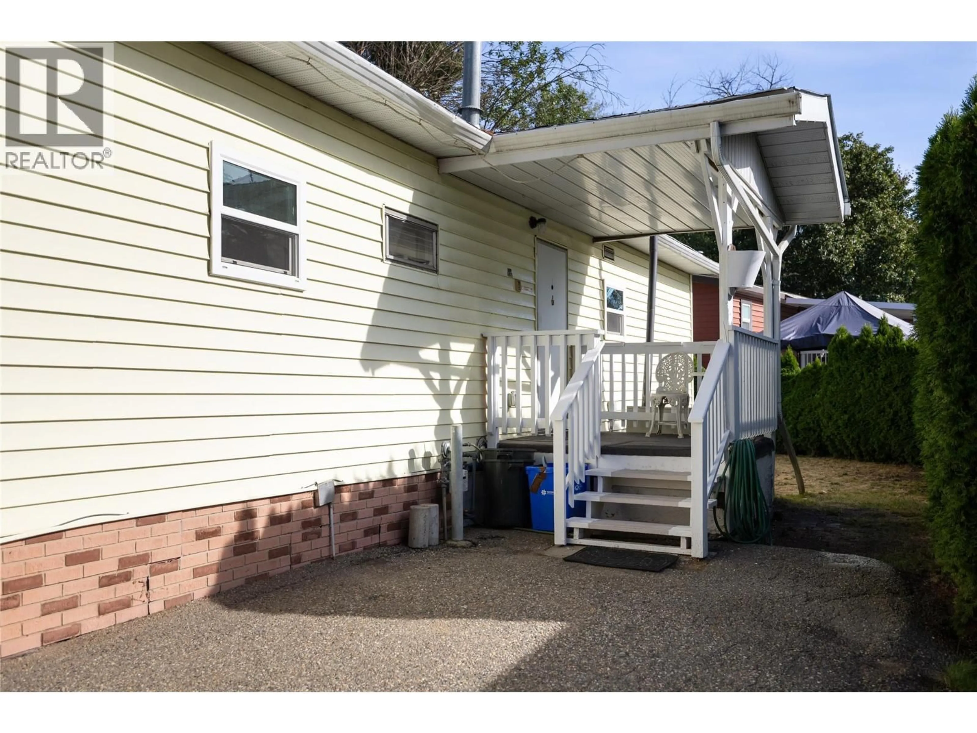 Home with vinyl exterior material, street for 23 - 4701 PLEASANT VALLEY ROAD, Vernon British Columbia V1T4M7