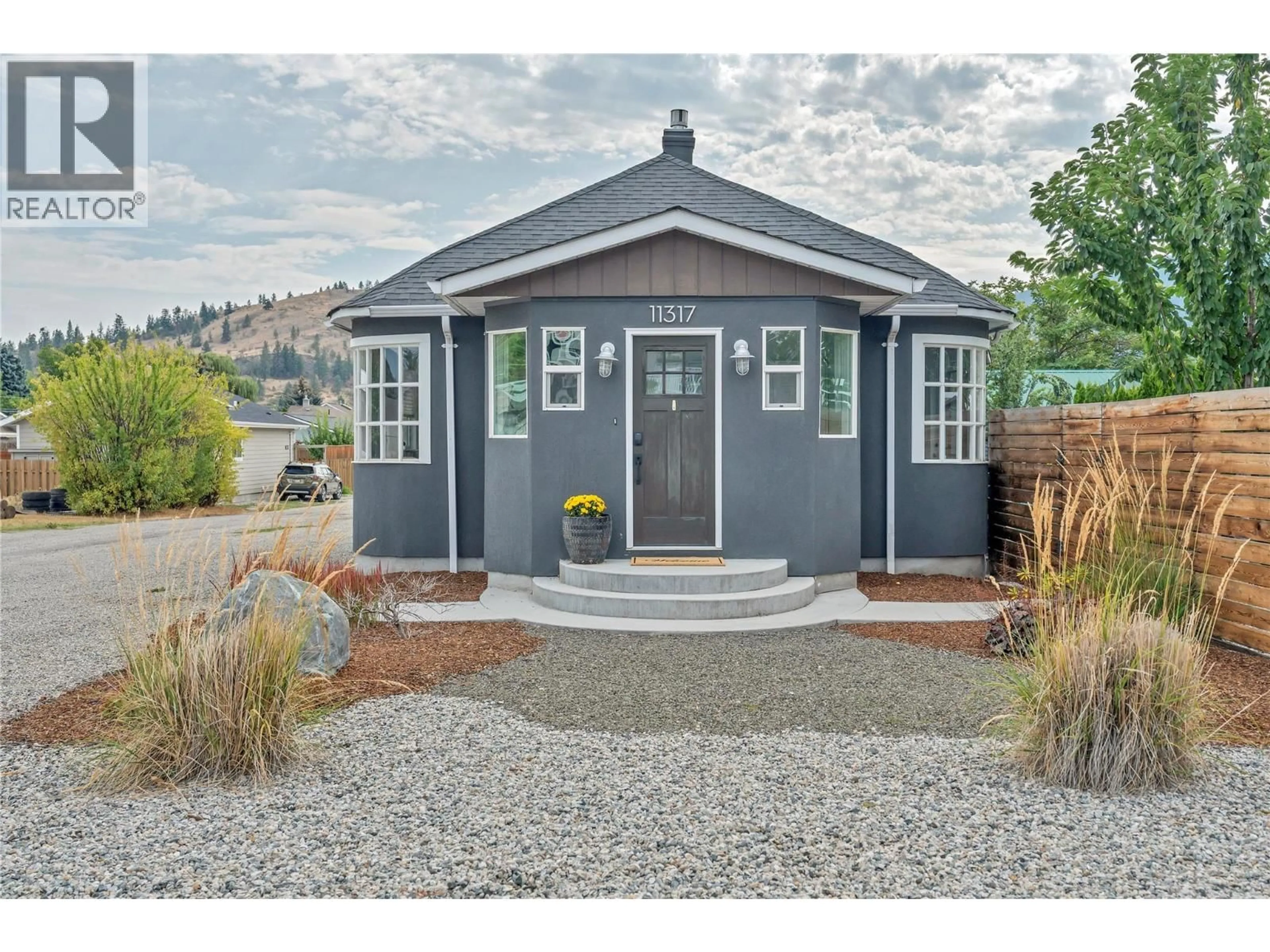 Home with vinyl exterior material, street for 11317 PRAIRIE VALLEY ROAD, Summerland British Columbia V0H1Z8