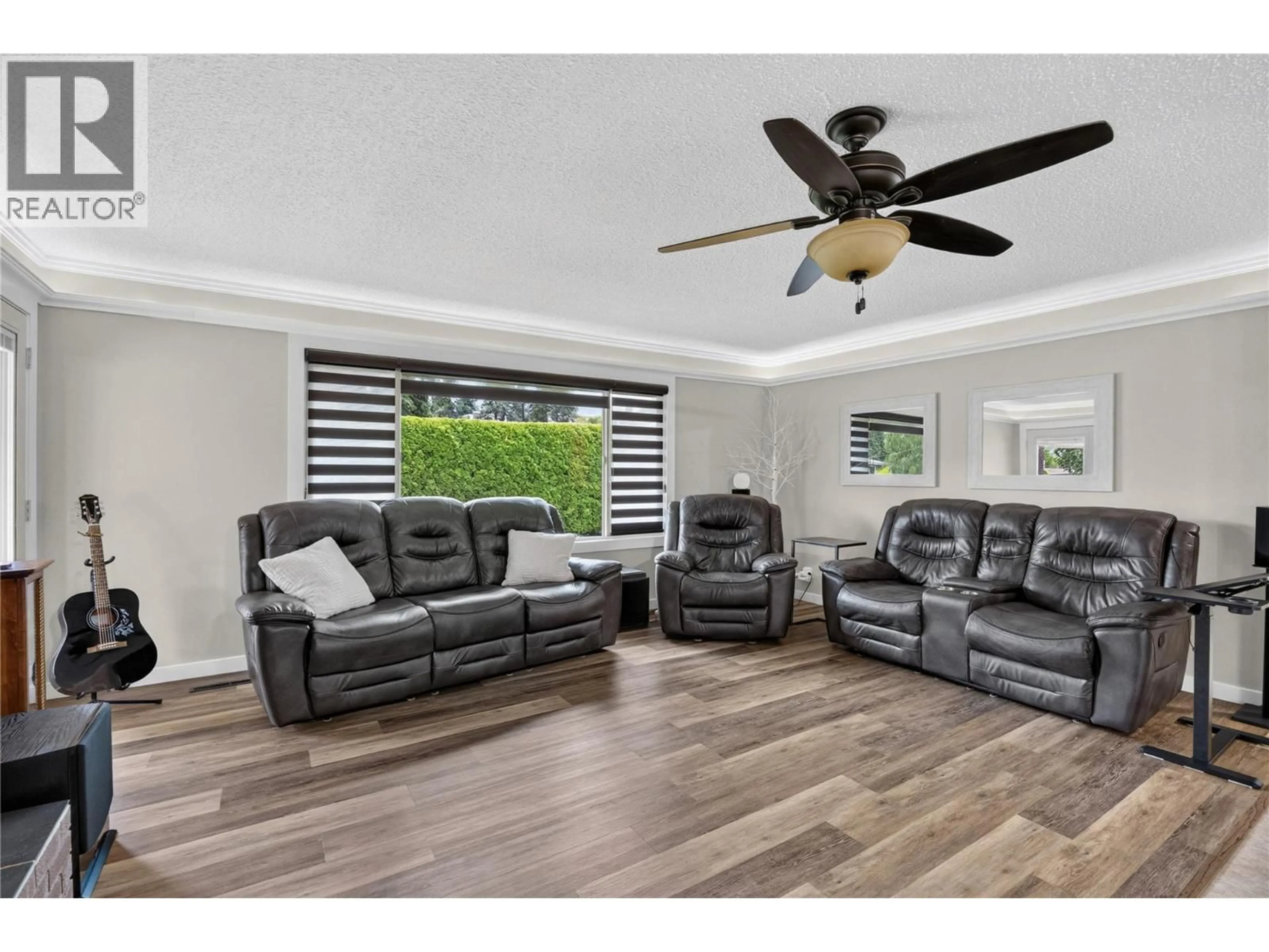 Living room with furniture, wood/laminate floor for 11304 DUNSDON CRESCENT, Summerland British Columbia V0H1Z0