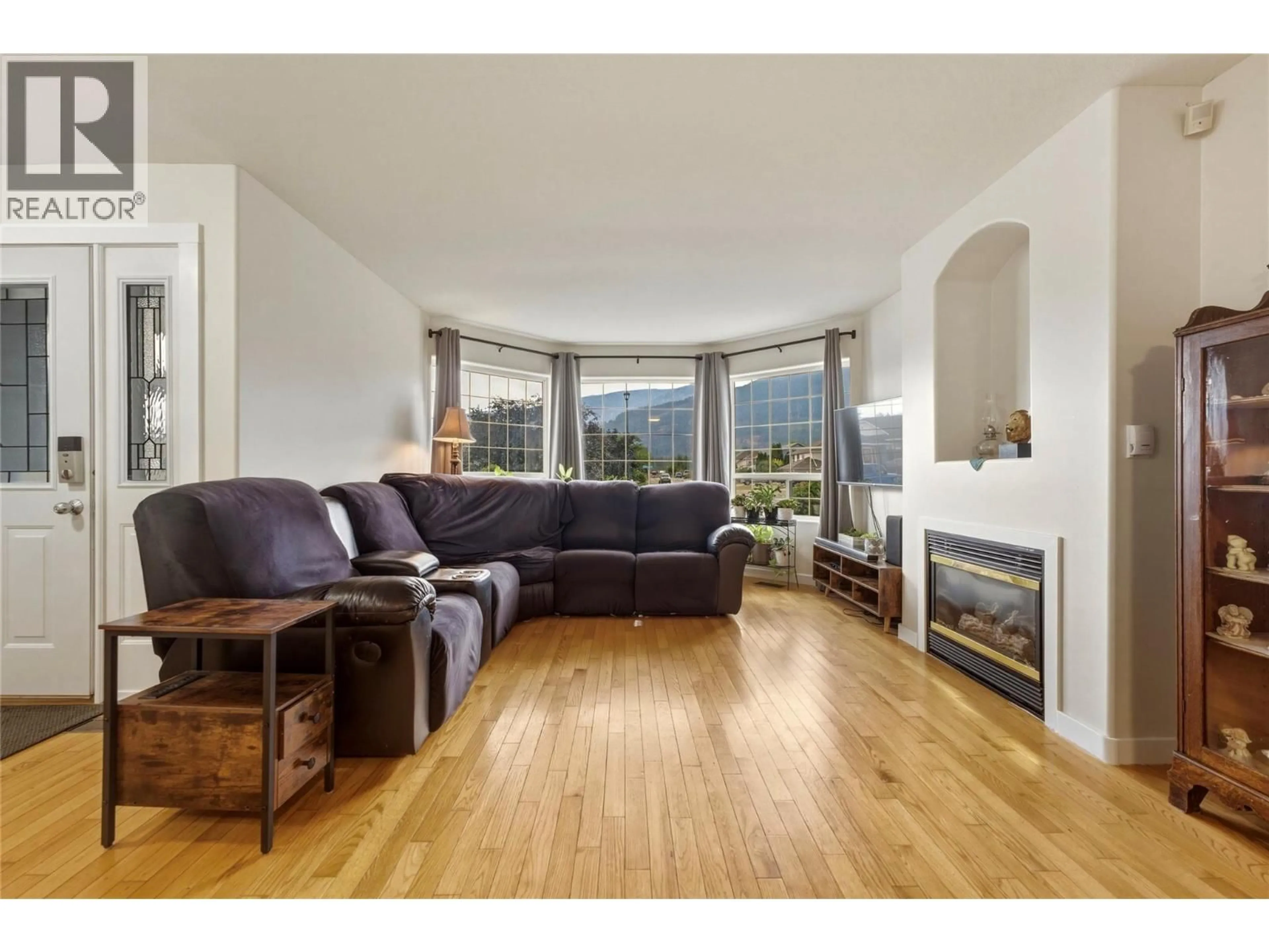 Living room with furniture, wood/laminate floor for 2419 BRADLEY DRIVE, Armstrong British Columbia V0E1B1