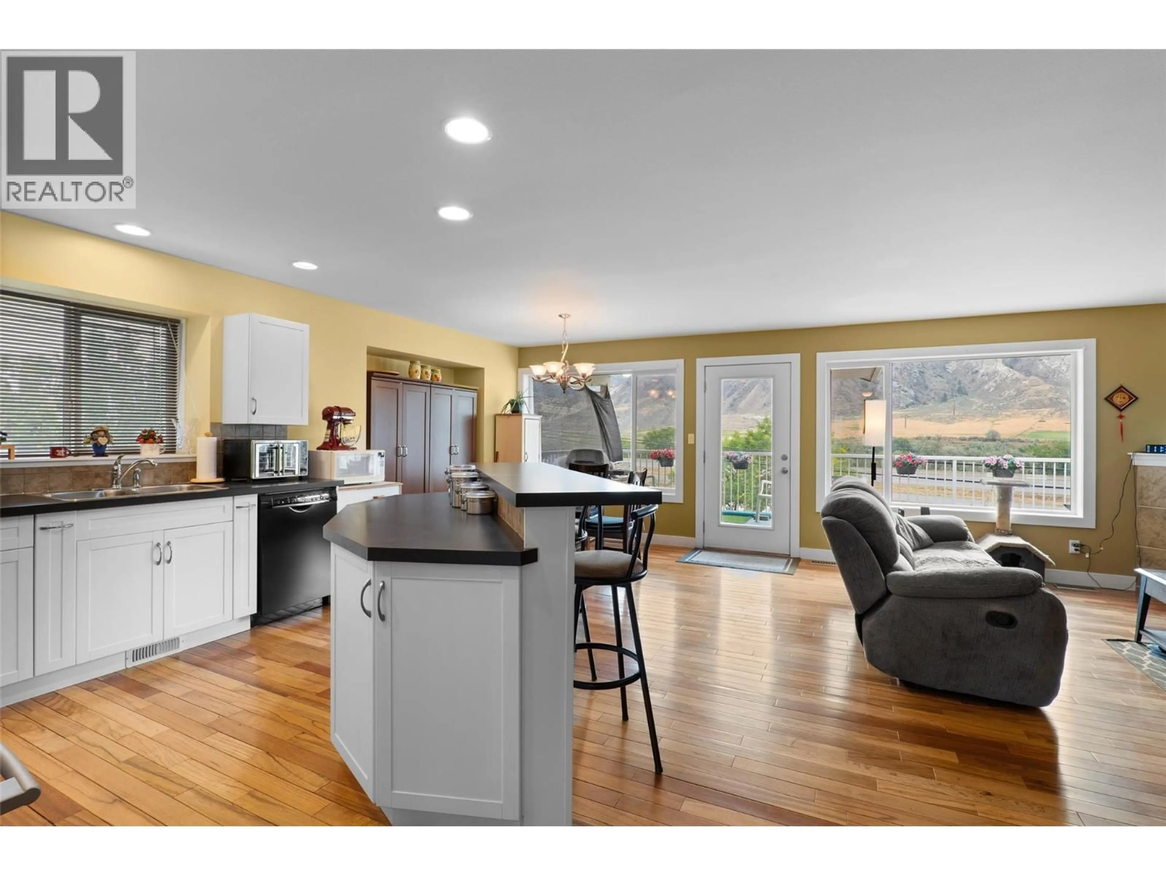 Open concept kitchen, wood/laminate floor for 7304 RAMBLER PLACE, Kamloops British Columbia V2C6Z1