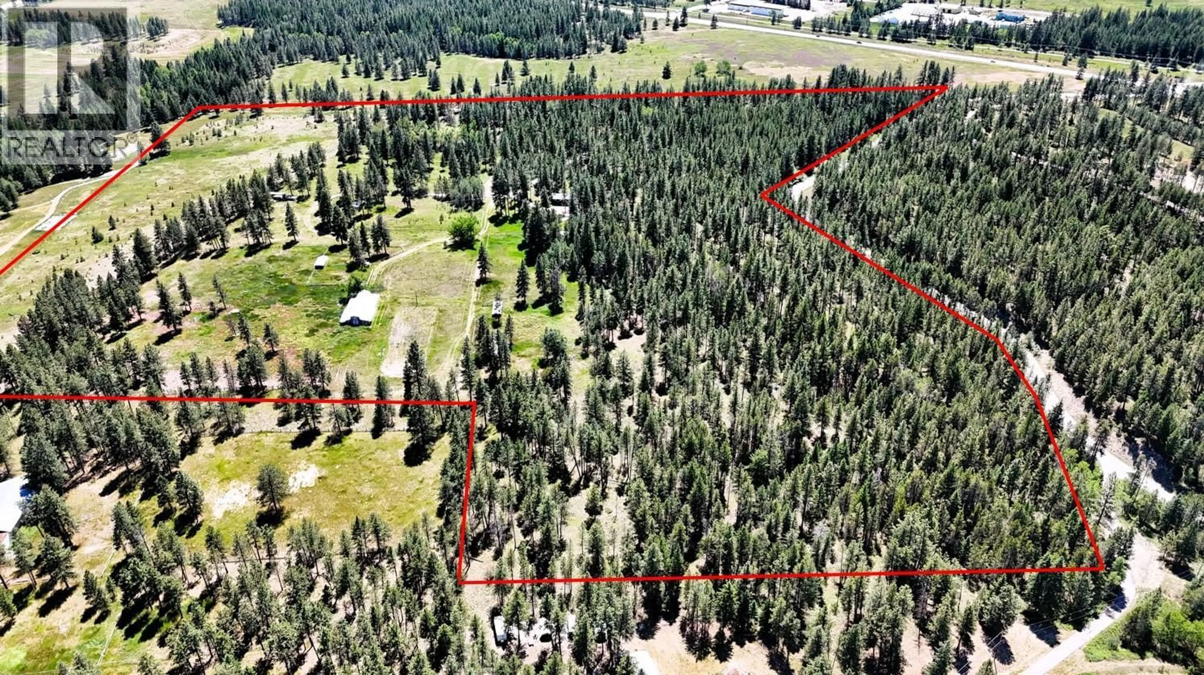 A pic from outside/outdoor area/front of a property/back of a property/a pic from drone, forest/trees view for 4836 KENNEDY ROAD, Cranbrook British Columbia V1C7C1