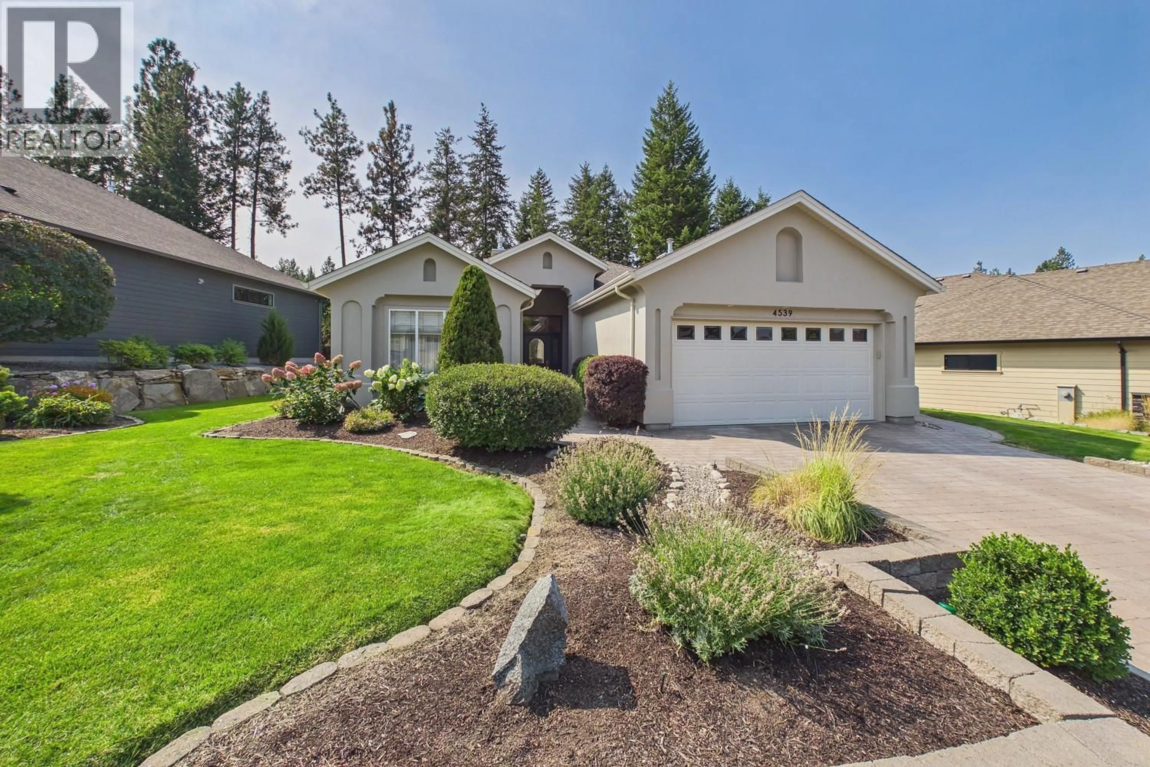 Home with vinyl exterior material, street for 4539 GALLAGHERS EDGEWOOD DRIVE, Kelowna British Columbia V1W5E6