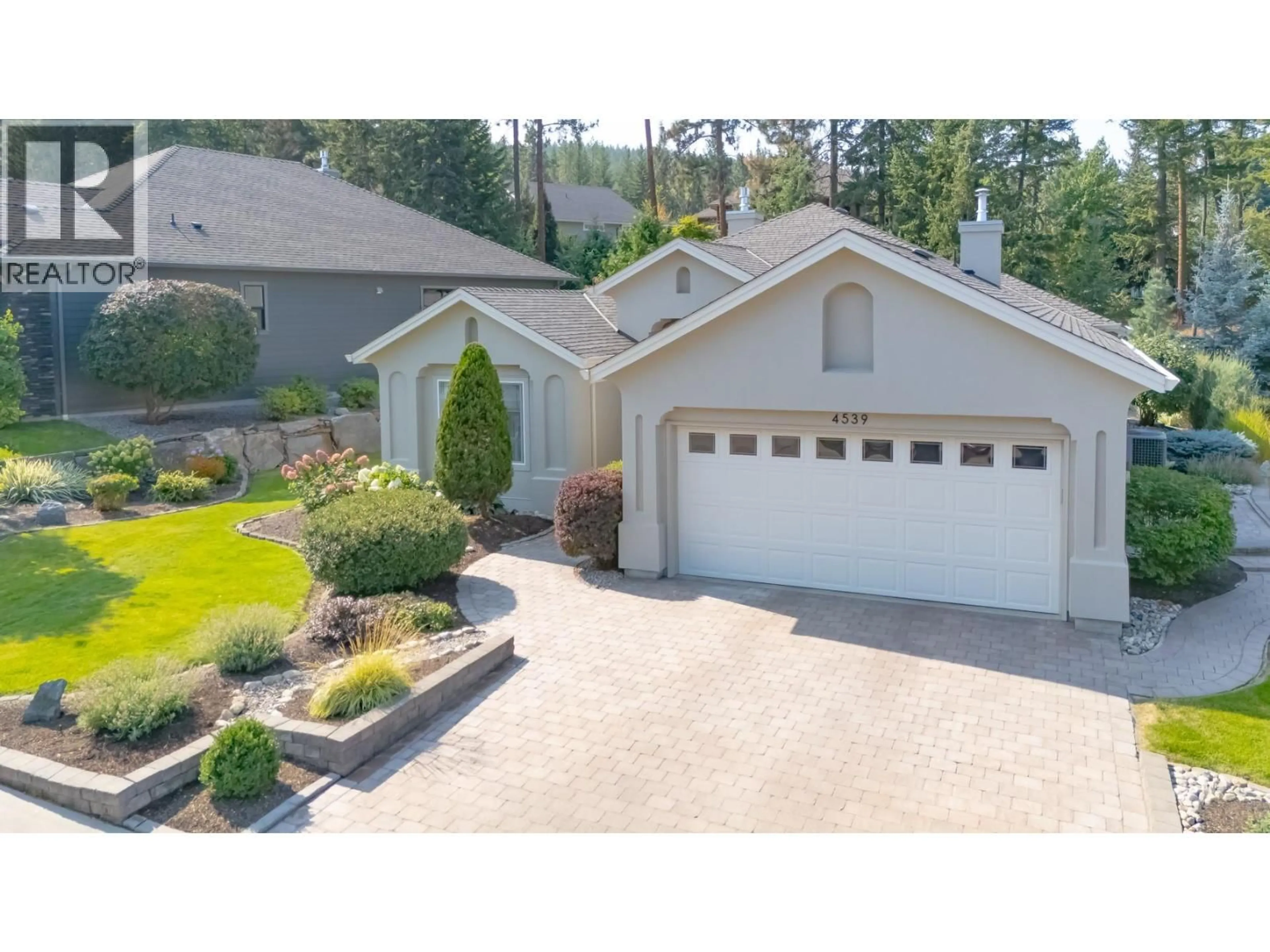 A pic from outside/outdoor area/front of a property/back of a property/a pic from drone, street for 4539 GALLAGHERS EDGEWOOD DRIVE, Kelowna British Columbia V1W5E6