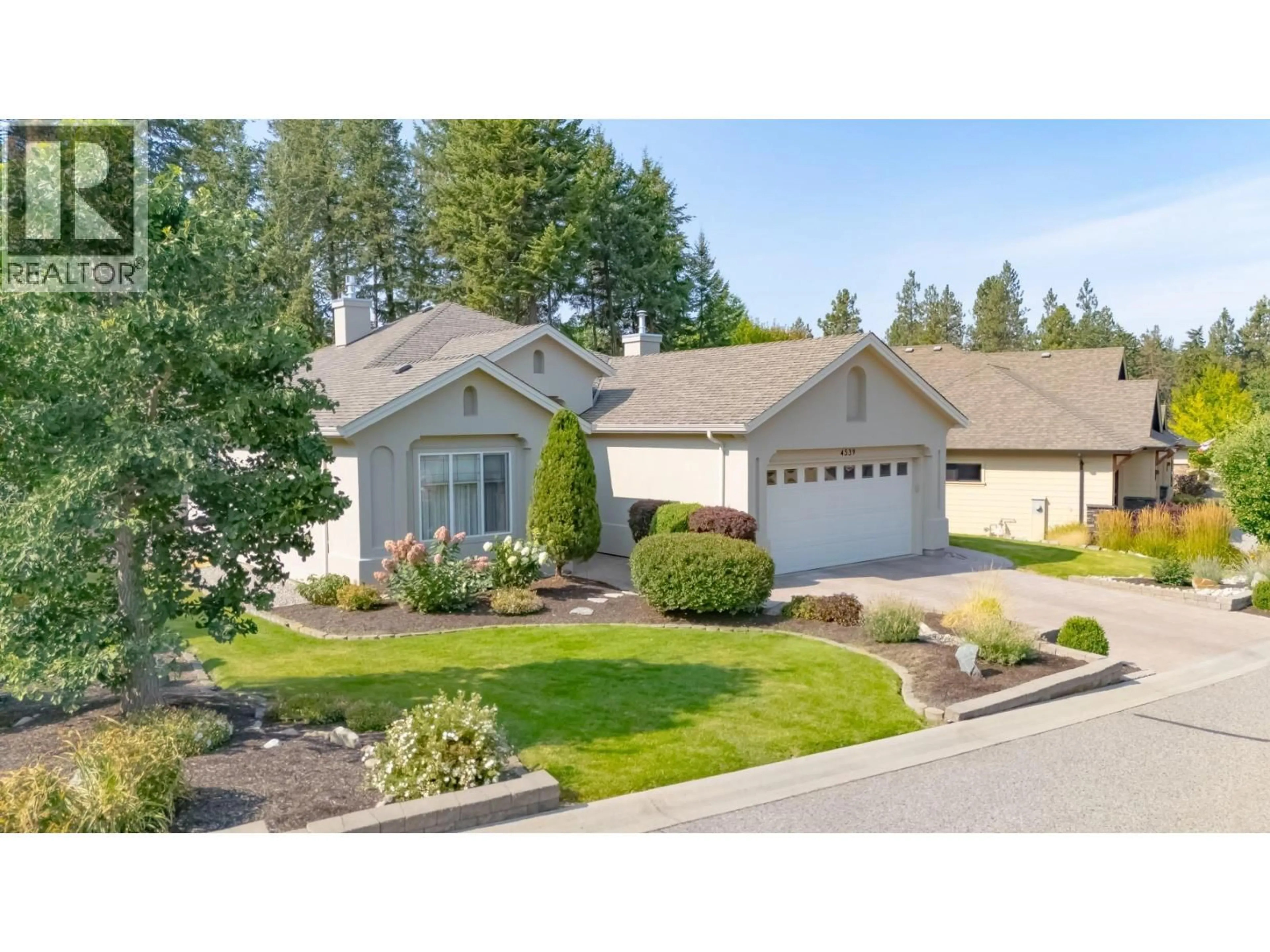Home with vinyl exterior material, street for 4539 GALLAGHERS EDGEWOOD DRIVE, Kelowna British Columbia V1W5E6