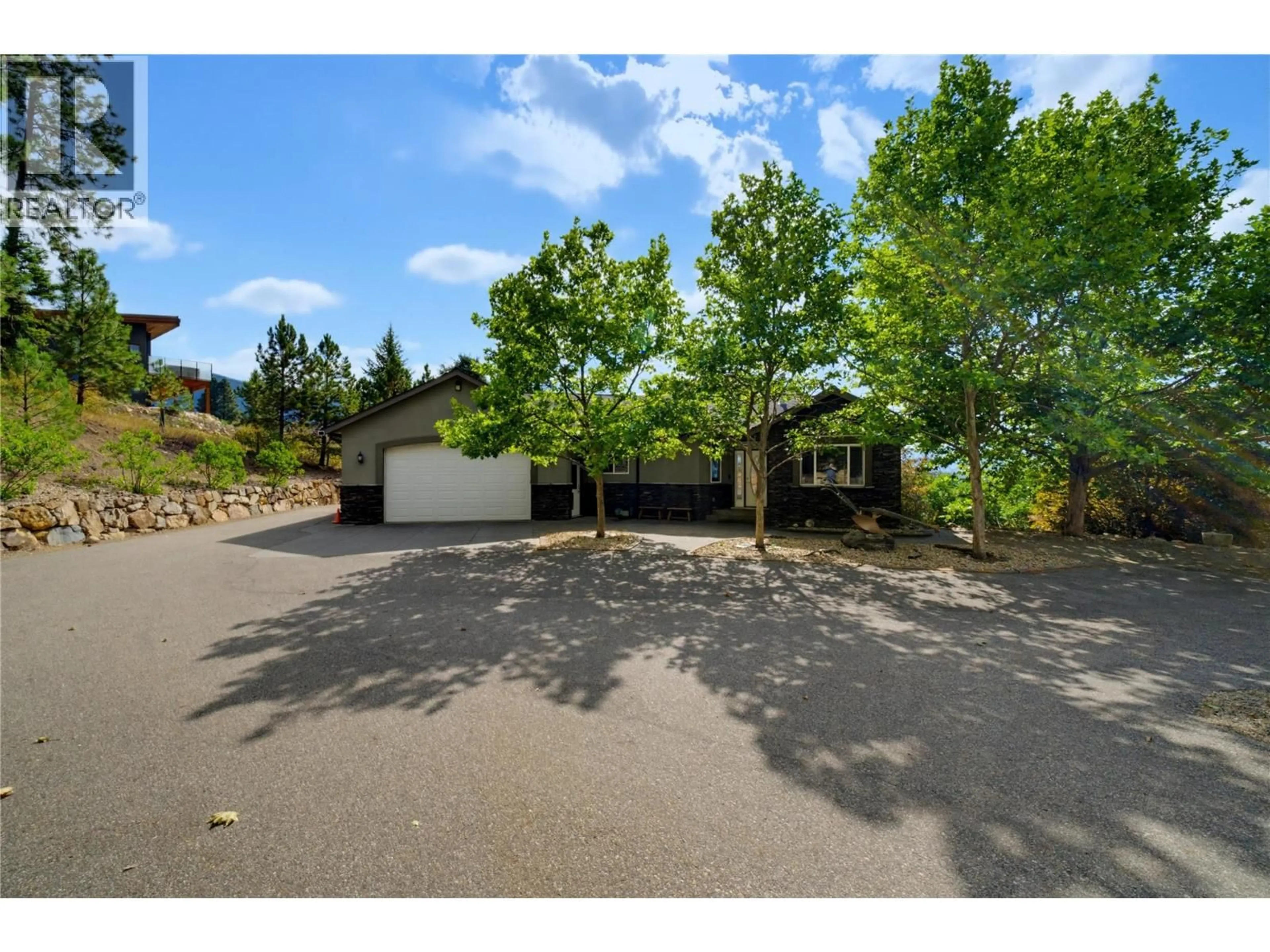 A pic from outside/outdoor area/front of a property/back of a property/a pic from drone, street for 2708 SUNRIDGE PLACE, Tappen British Columbia V0E2X3