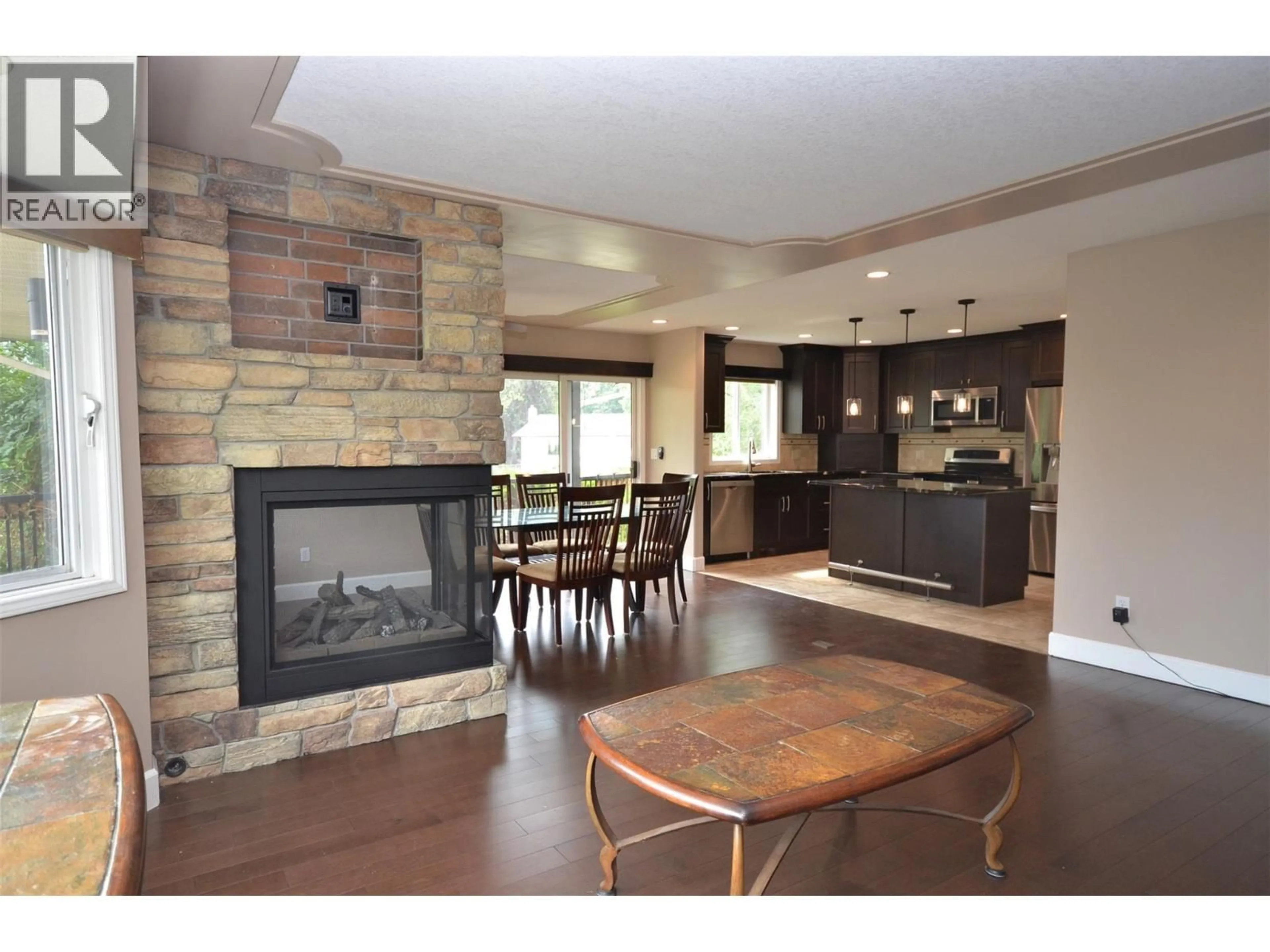 Open concept kitchen, wood/laminate floor for 65 SARSONS PLACE, Coldstream British Columbia V1B2K8