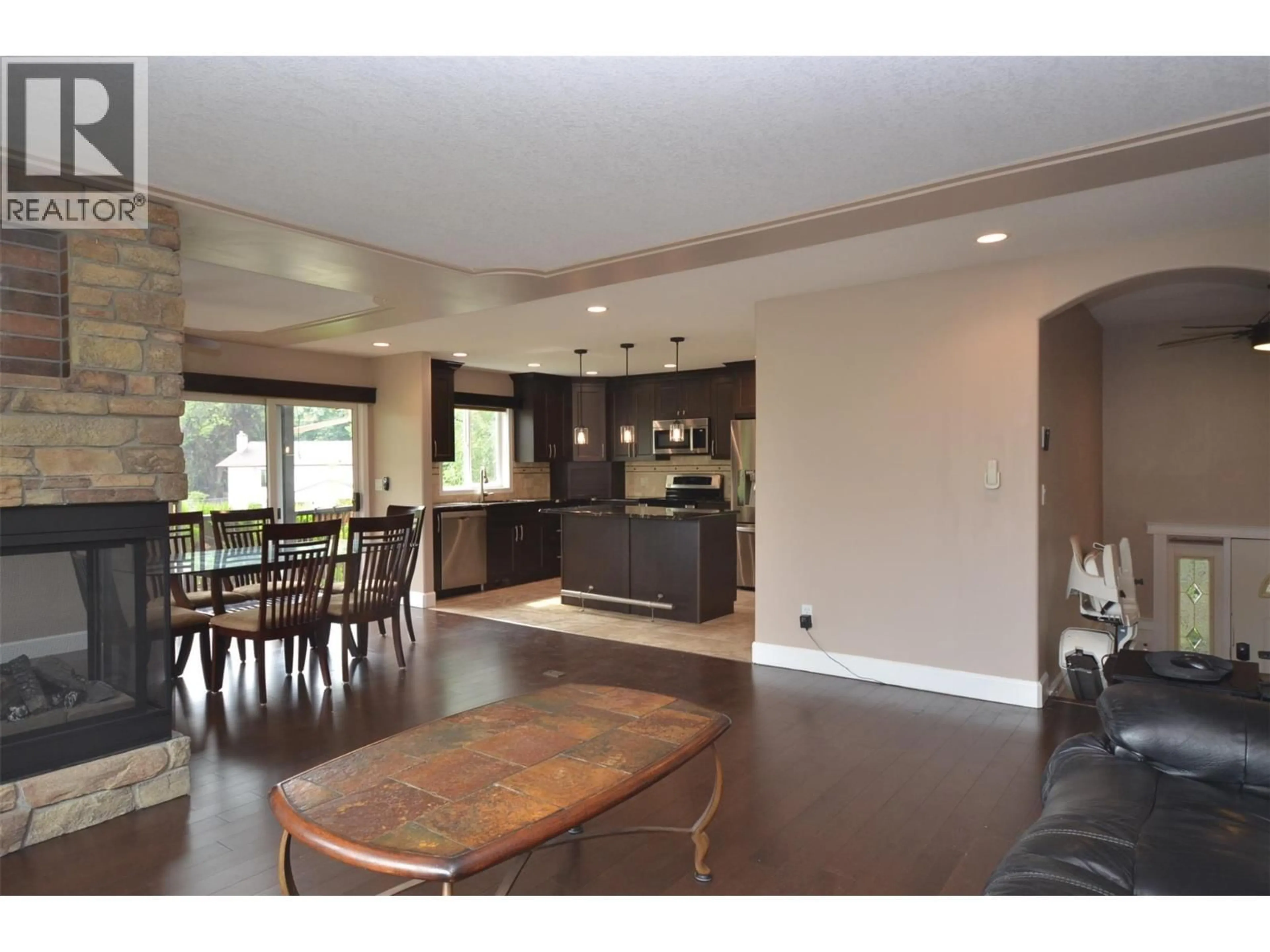 Open concept kitchen, wood/laminate floor for 65 SARSONS PLACE, Coldstream British Columbia V1B2K8