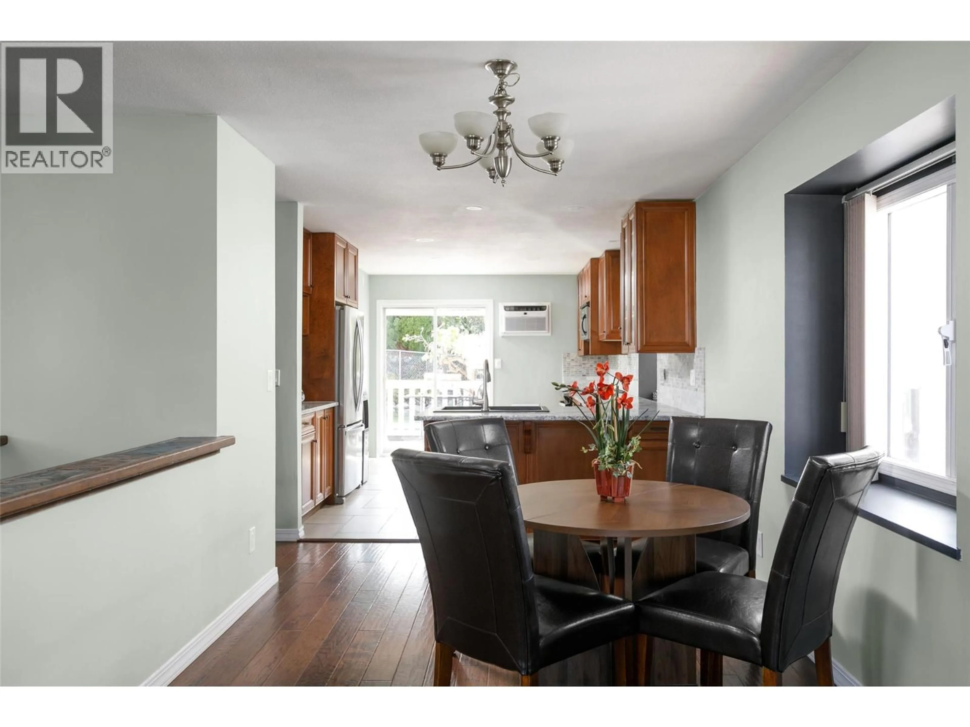 Dining room, wood/laminate floor for 8 - 6400 SPENCER ROAD, Kelowna British Columbia V1X7T6