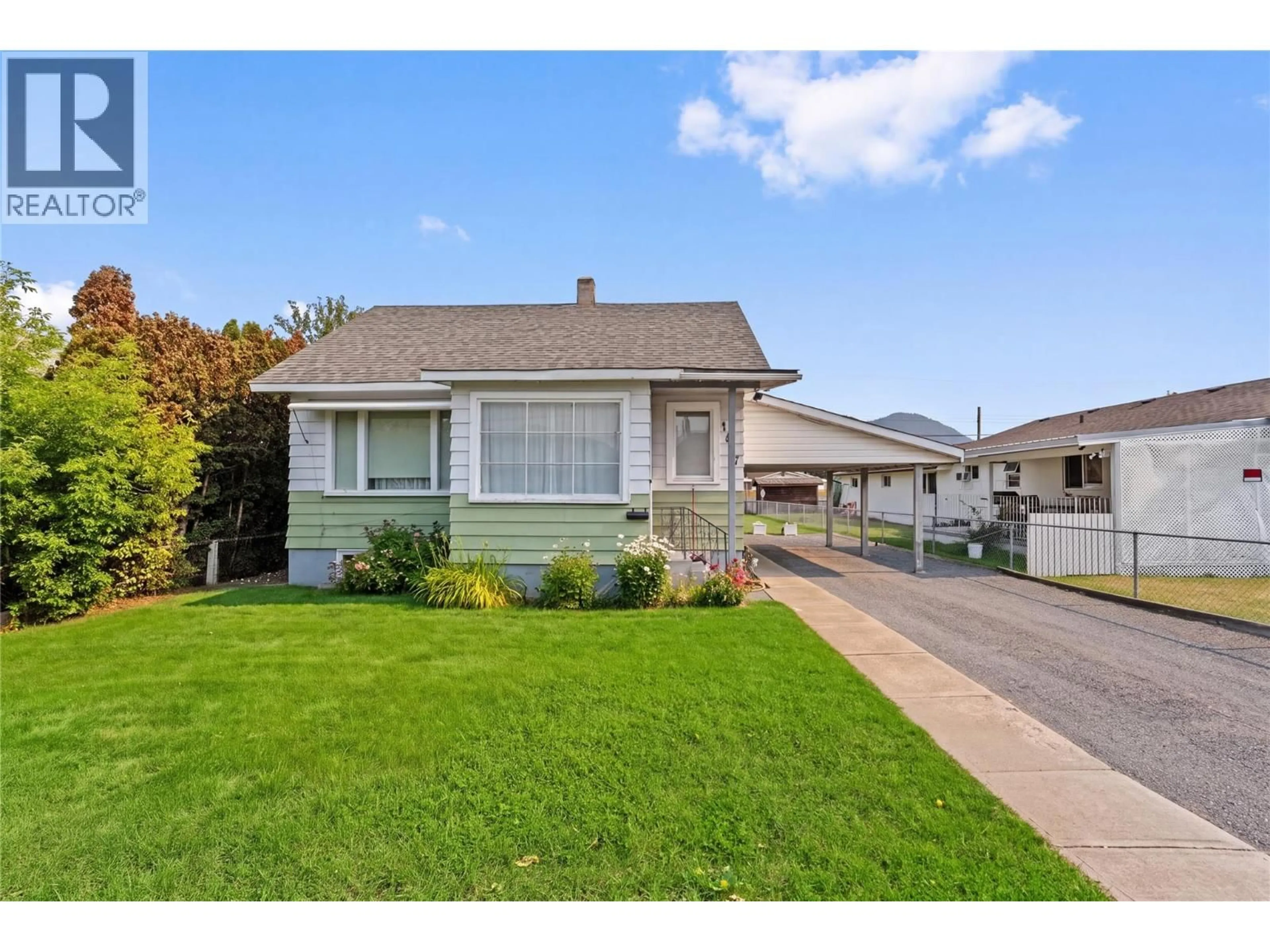 Home with vinyl exterior material, street for 1887 GRANITE AVENUE, Merritt British Columbia V1K1B8