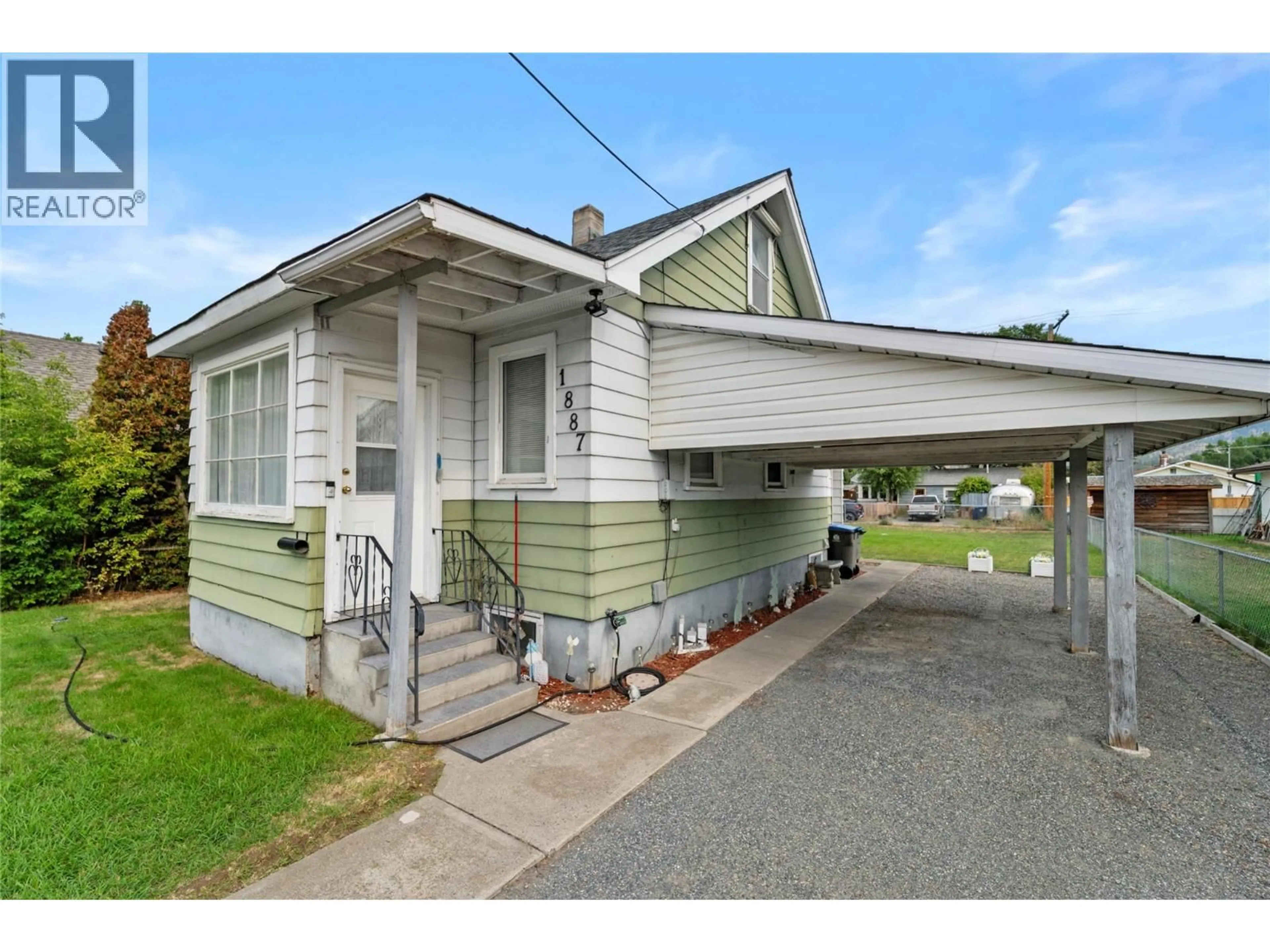 Home with vinyl exterior material, street for 1887 GRANITE AVENUE, Merritt British Columbia V1K1B8