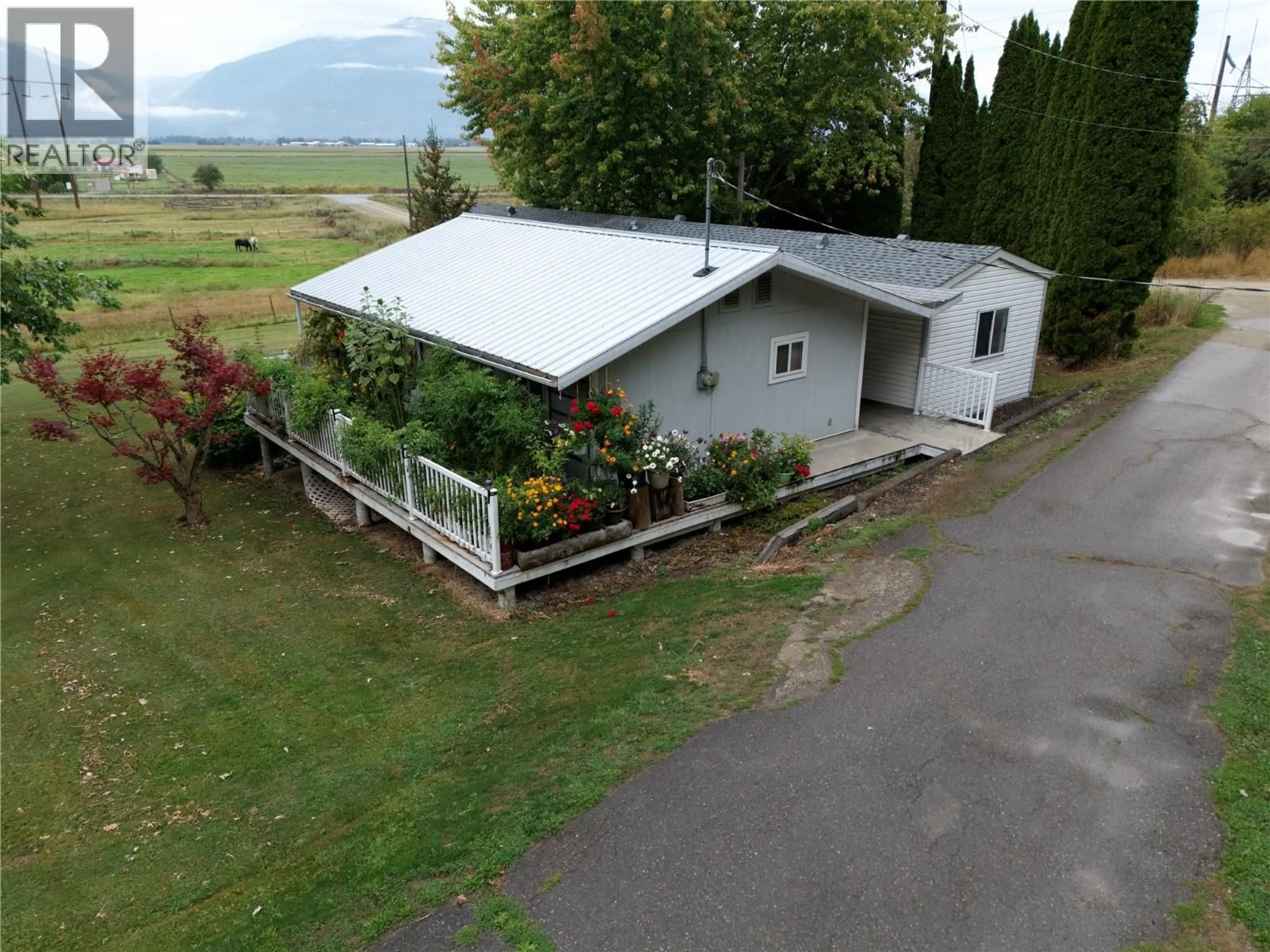A pic from outside/outdoor area/front of a property/back of a property/a pic from drone, mountain view for 1-2780 ROCKY POINT ROAD, Creston British Columbia V0B1G8