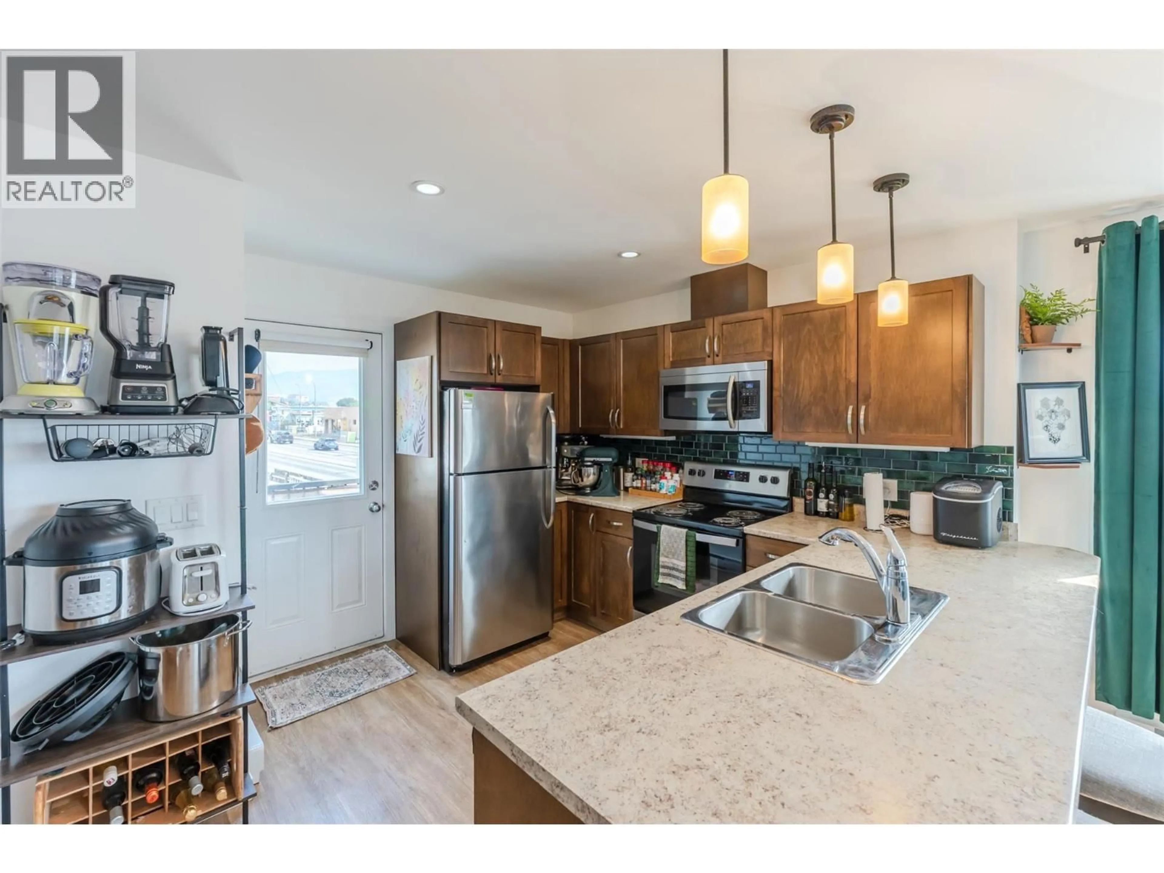 Open concept kitchen, unknown for 102 - 707 REVELSTOKE AVENUE, Penticton British Columbia V2A2J1