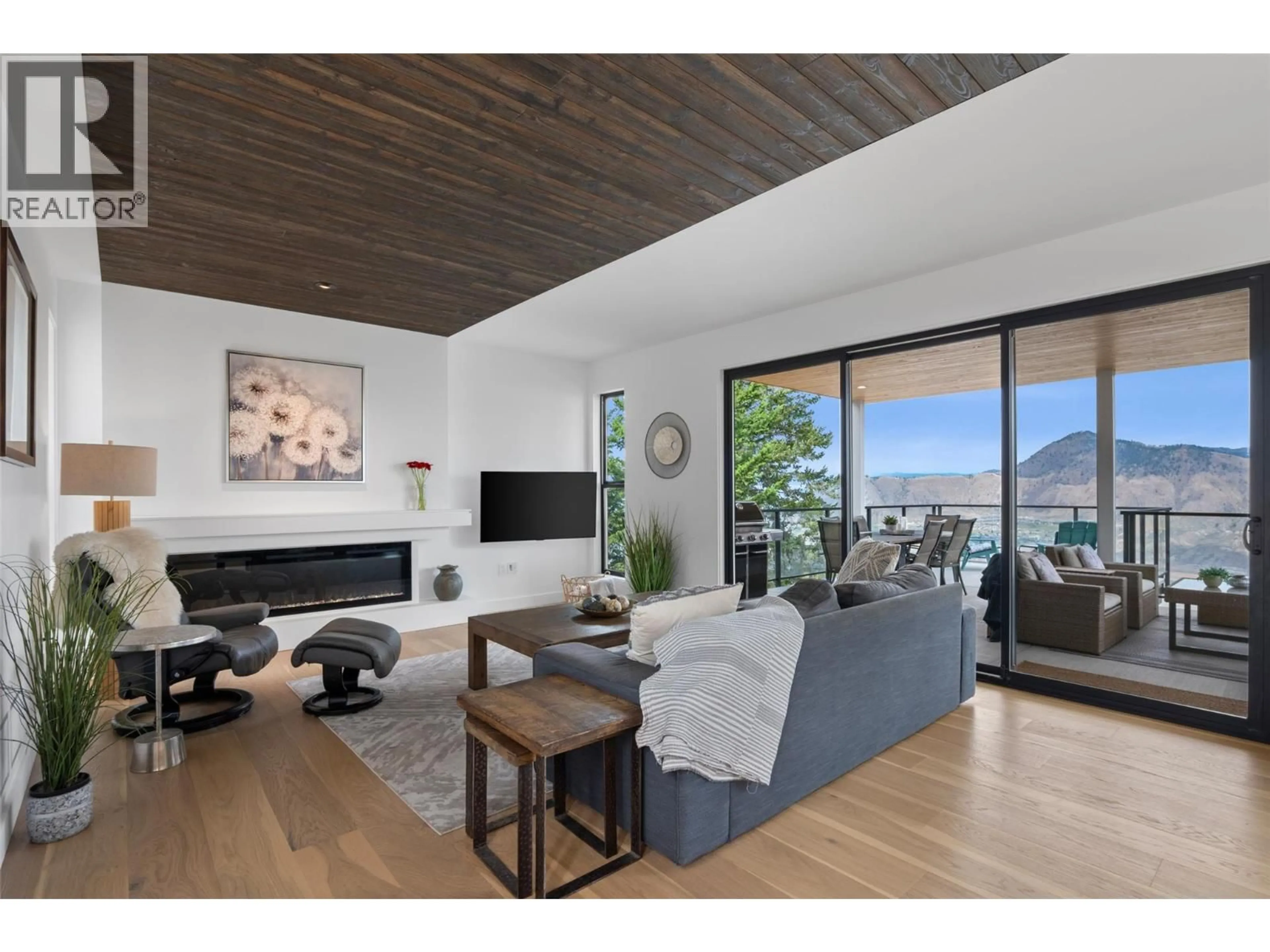 Living room with furniture, wood/laminate floor for 2179 LUPIN COURT, Kamloops British Columbia V2E0E2