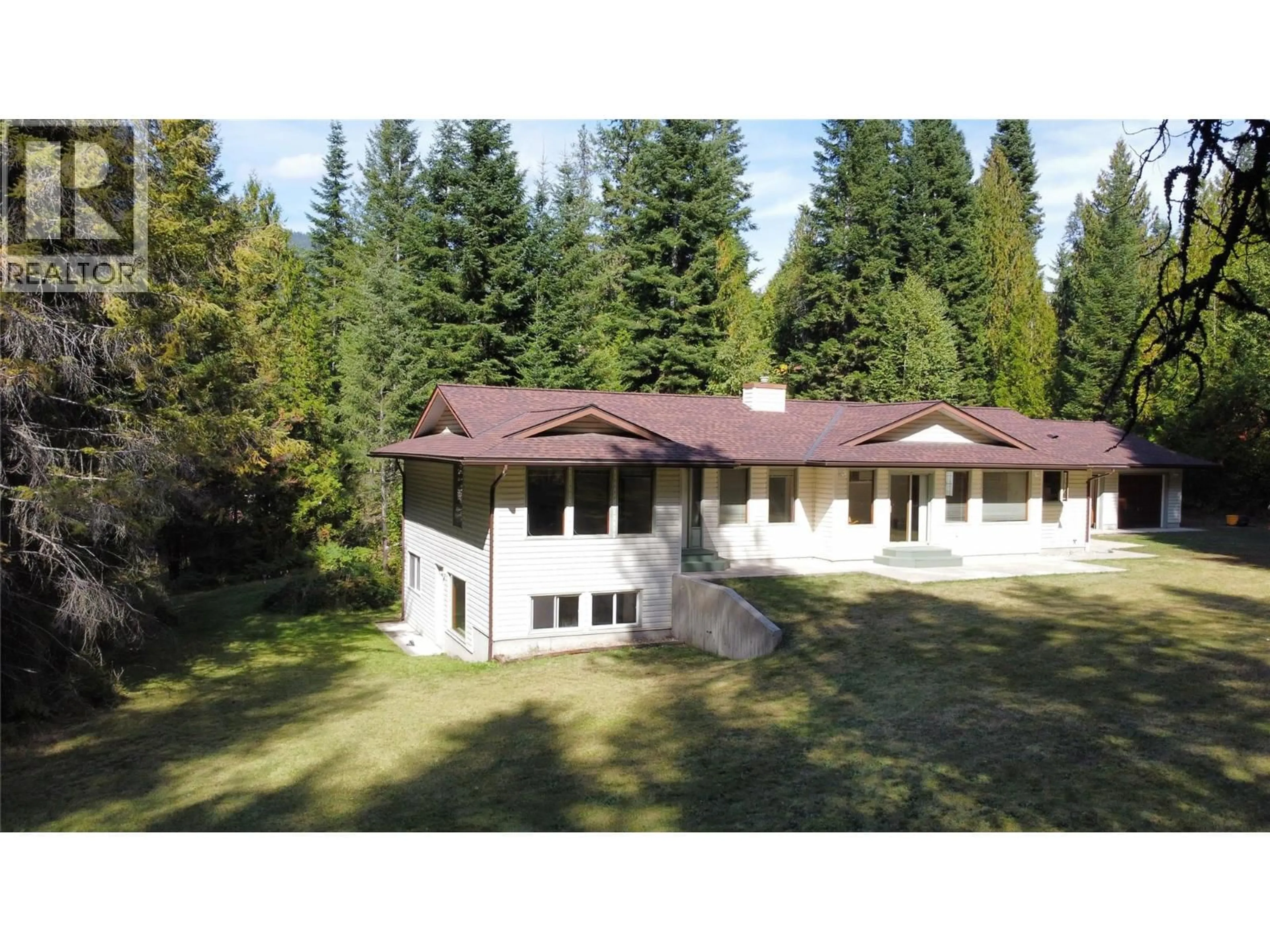 A pic from outside/outdoor area/front of a property/back of a property/a pic from drone, forest/trees view for 1070 WEBB ROAD, South Slocan British Columbia V0G2G0