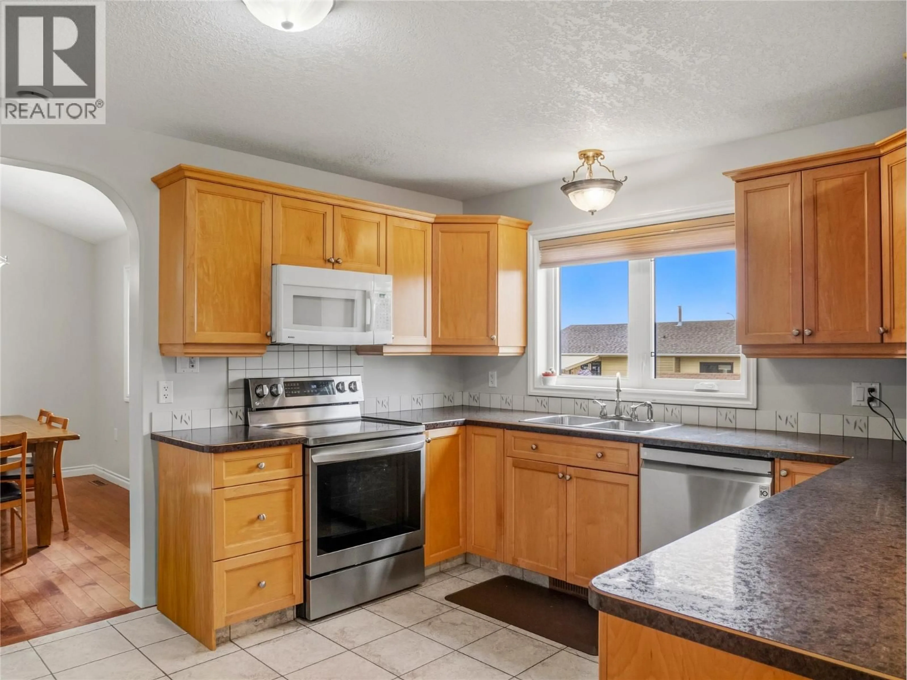 Standard kitchen, ceramic/tile floor for 8705 19A STREET, Dawson Creek British Columbia V1G0A6