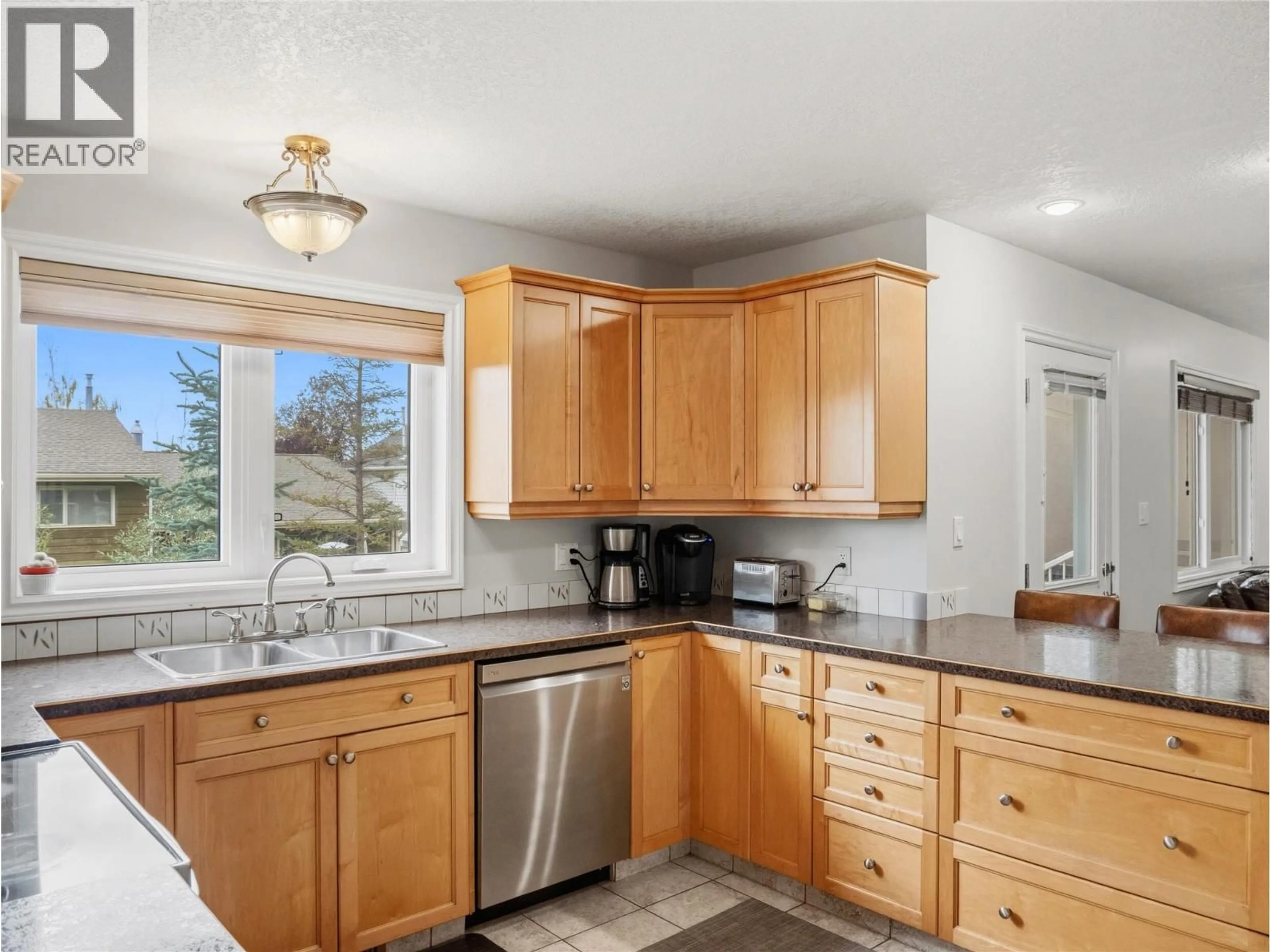 Open concept kitchen, ceramic/tile floor for 8705 19A STREET, Dawson Creek British Columbia V1G0A6