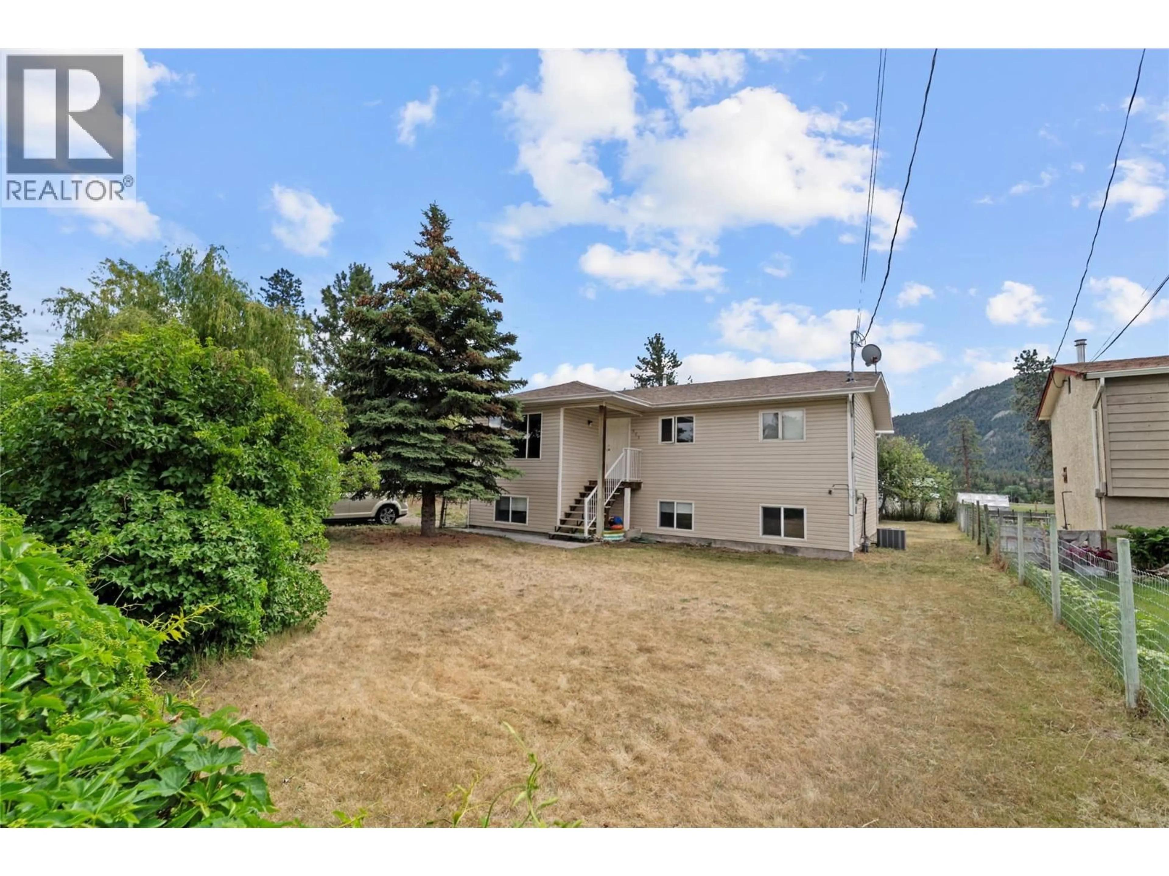A pic from outside/outdoor area/front of a property/back of a property/a pic from drone, mountain view for 462 DODDING AVENUE, Merritt British Columbia V0K1Y0