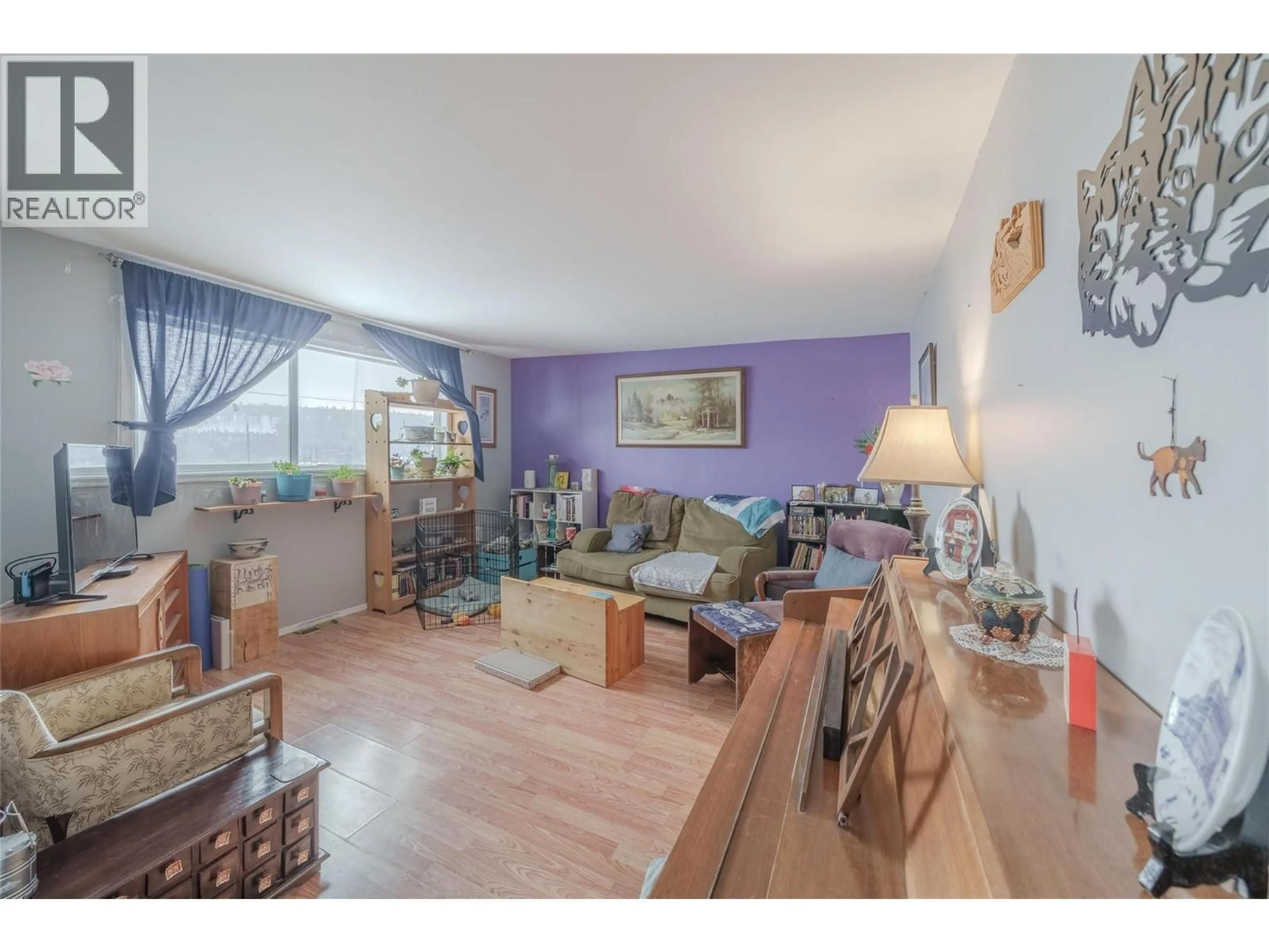 Living room with furniture, wood/laminate floor for 1504 CARSON STREET, Clinton British Columbia V0K1K0