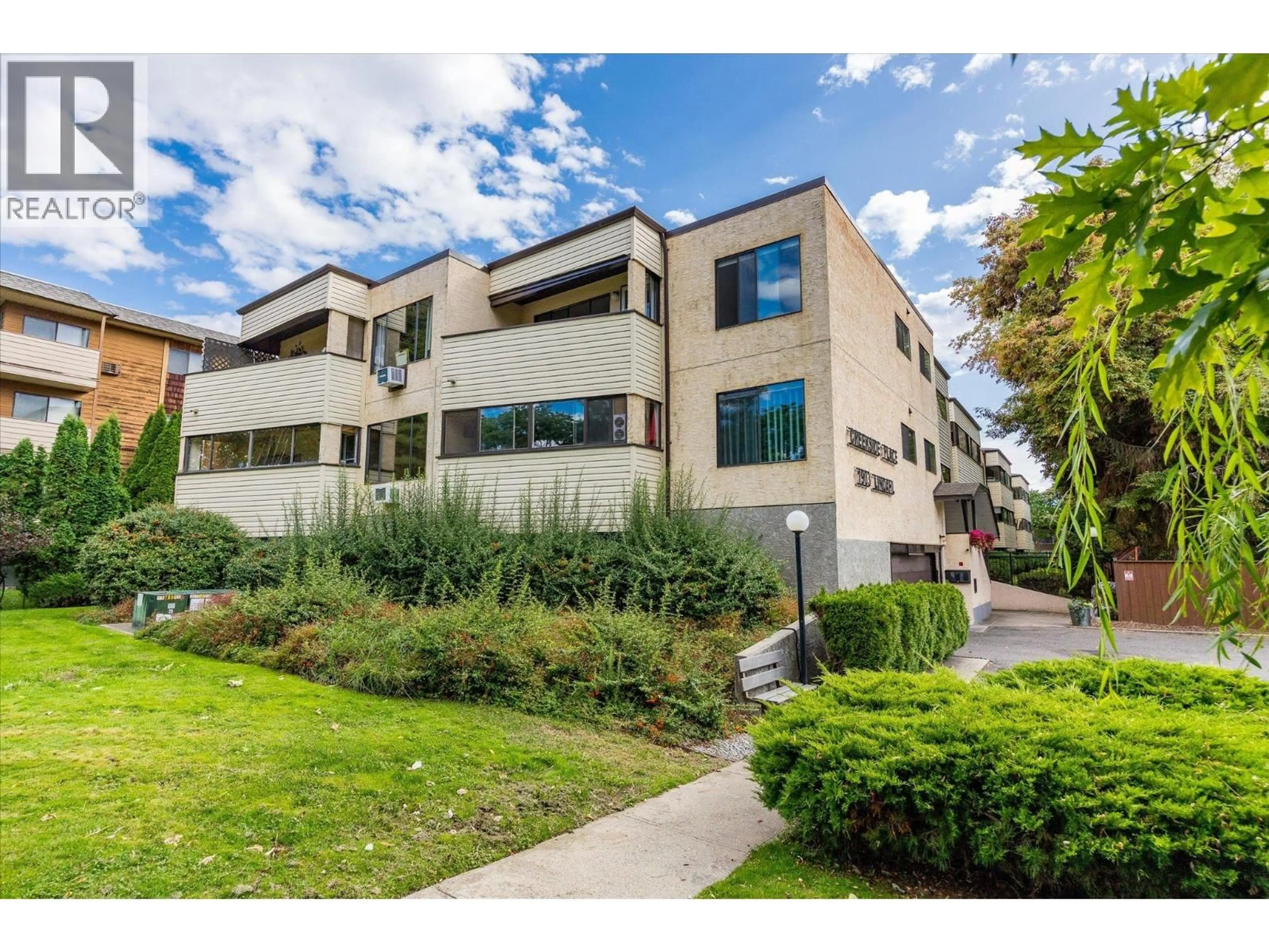 A pic from outside/outdoor area/front of a property/back of a property/a pic from drone, street for 106 - 1903 LINDAHL STREET, Kelowna British Columbia V1Y3Z6