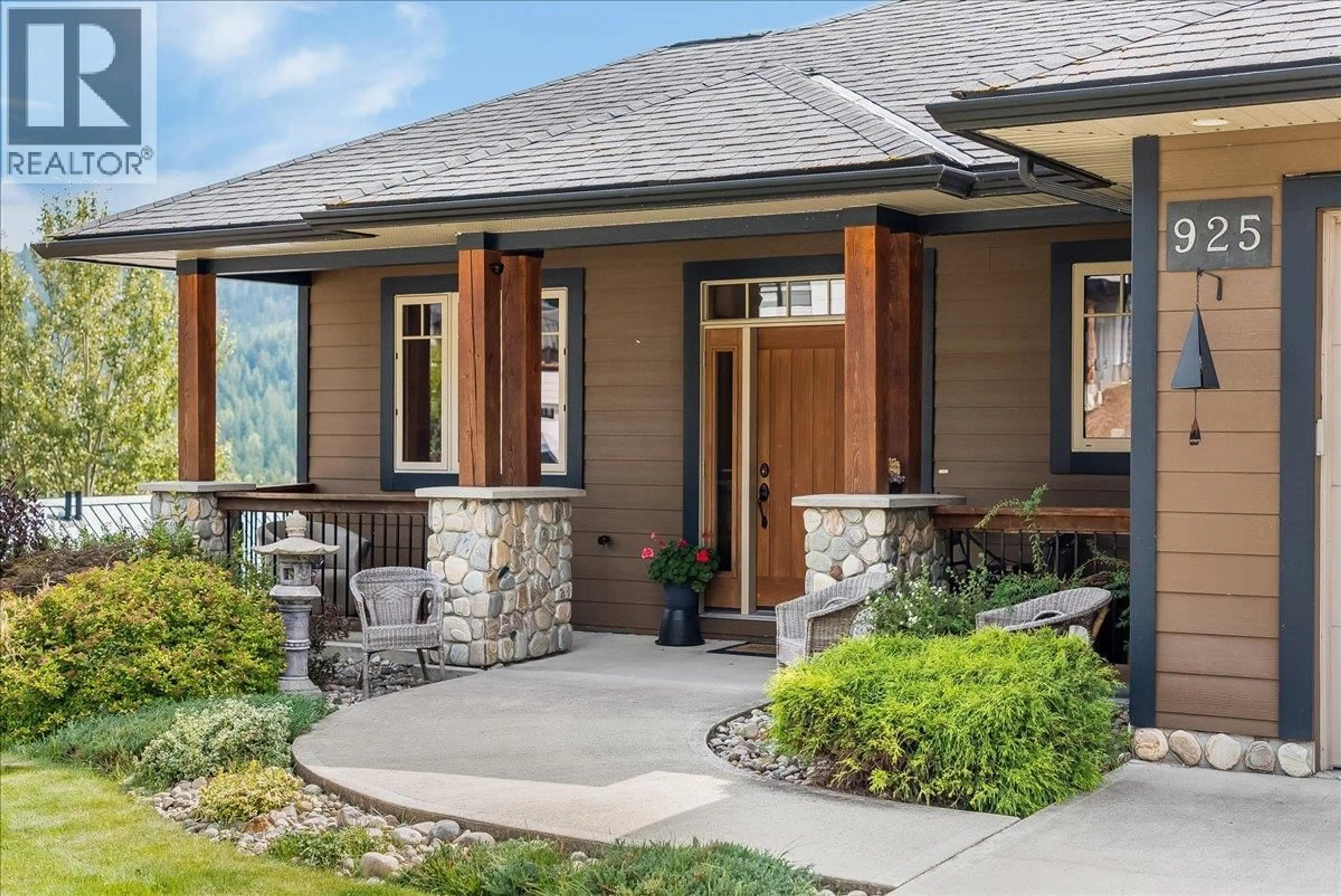 Home with brick exterior material, street for 925 REDSTONE DRIVE, Rossland British Columbia V0G1Y0