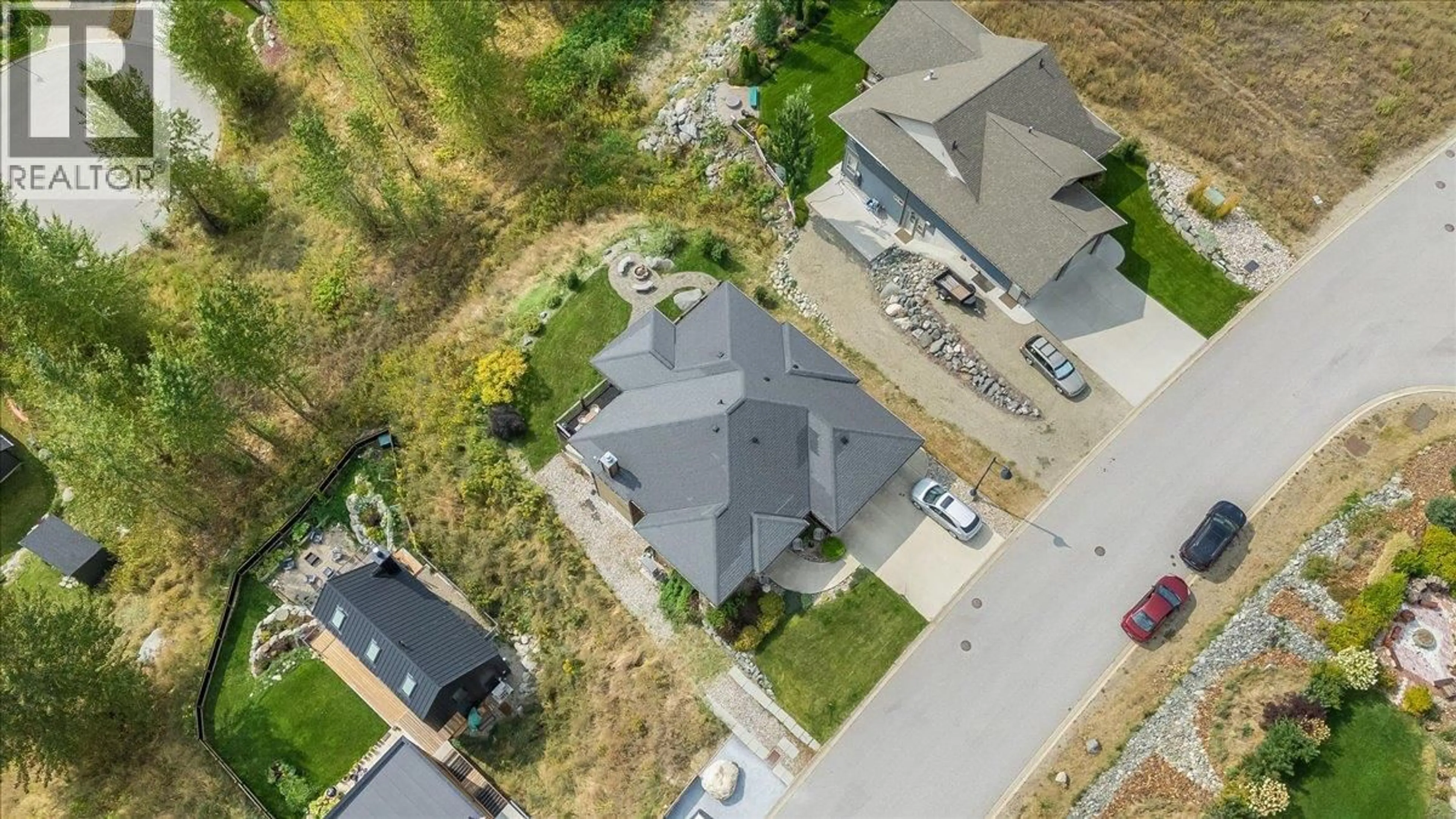A pic from outside/outdoor area/front of a property/back of a property/a pic from drone, street for 925 REDSTONE DRIVE, Rossland British Columbia V0G1Y0