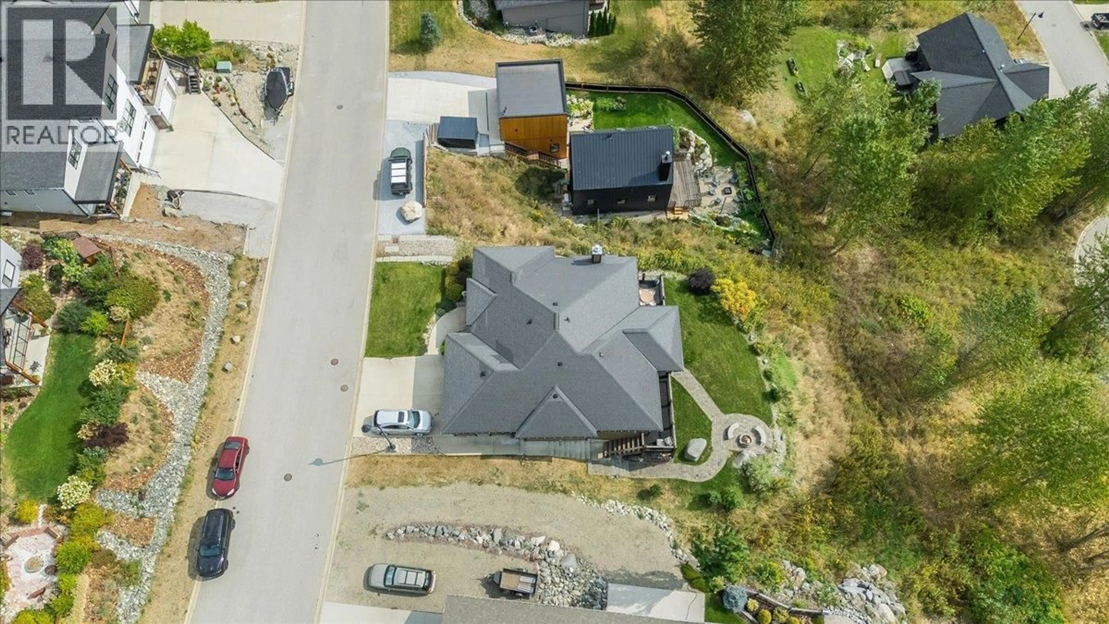 A pic from outside/outdoor area/front of a property/back of a property/a pic from drone, street for 925 REDSTONE DRIVE, Rossland British Columbia V0G1Y0