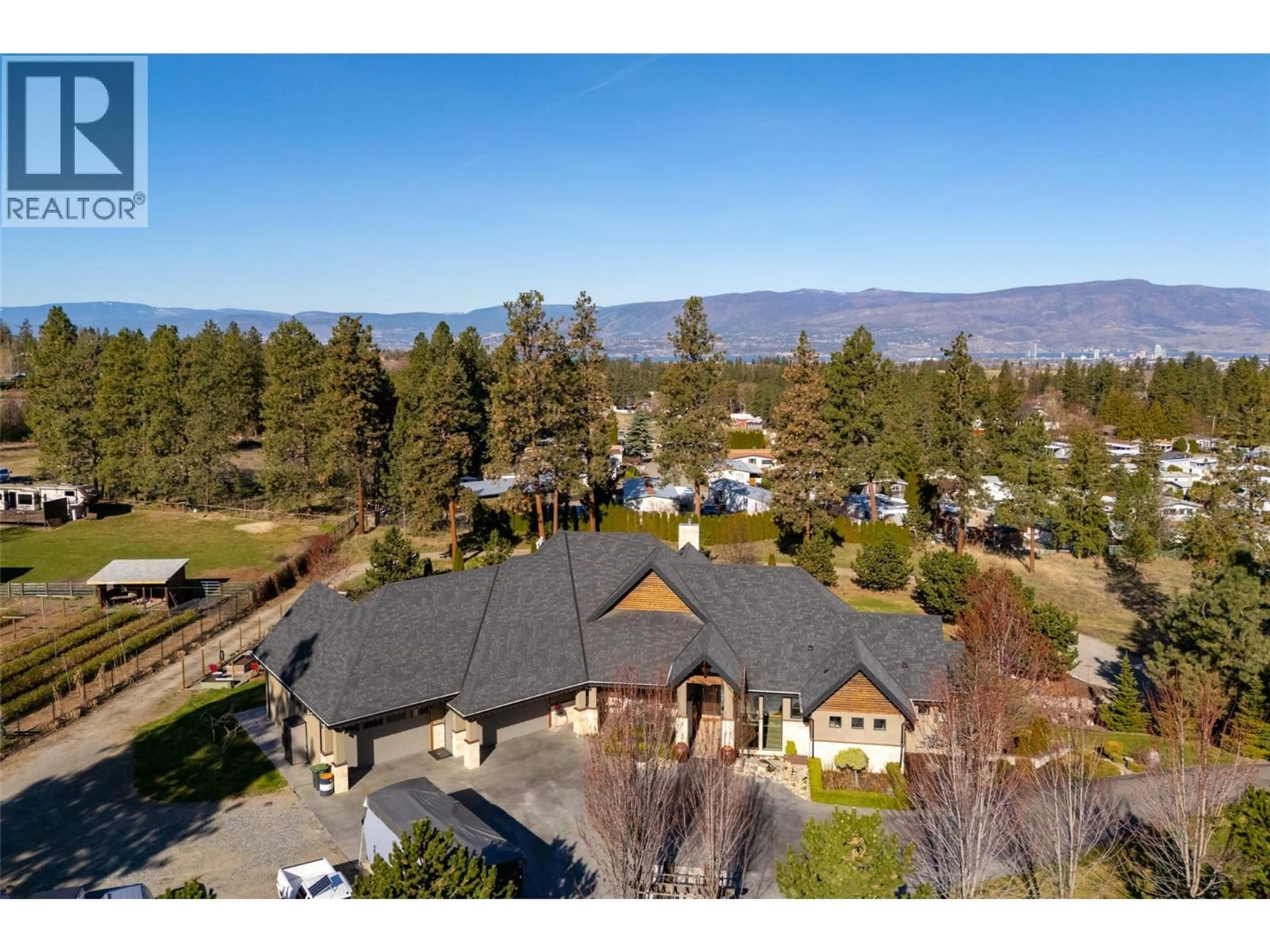 A pic from outside/outdoor area/front of a property/back of a property/a pic from drone, mountain view for 3990 FAIRWINDS COURT, Kelowna British Columbia V1W4G1