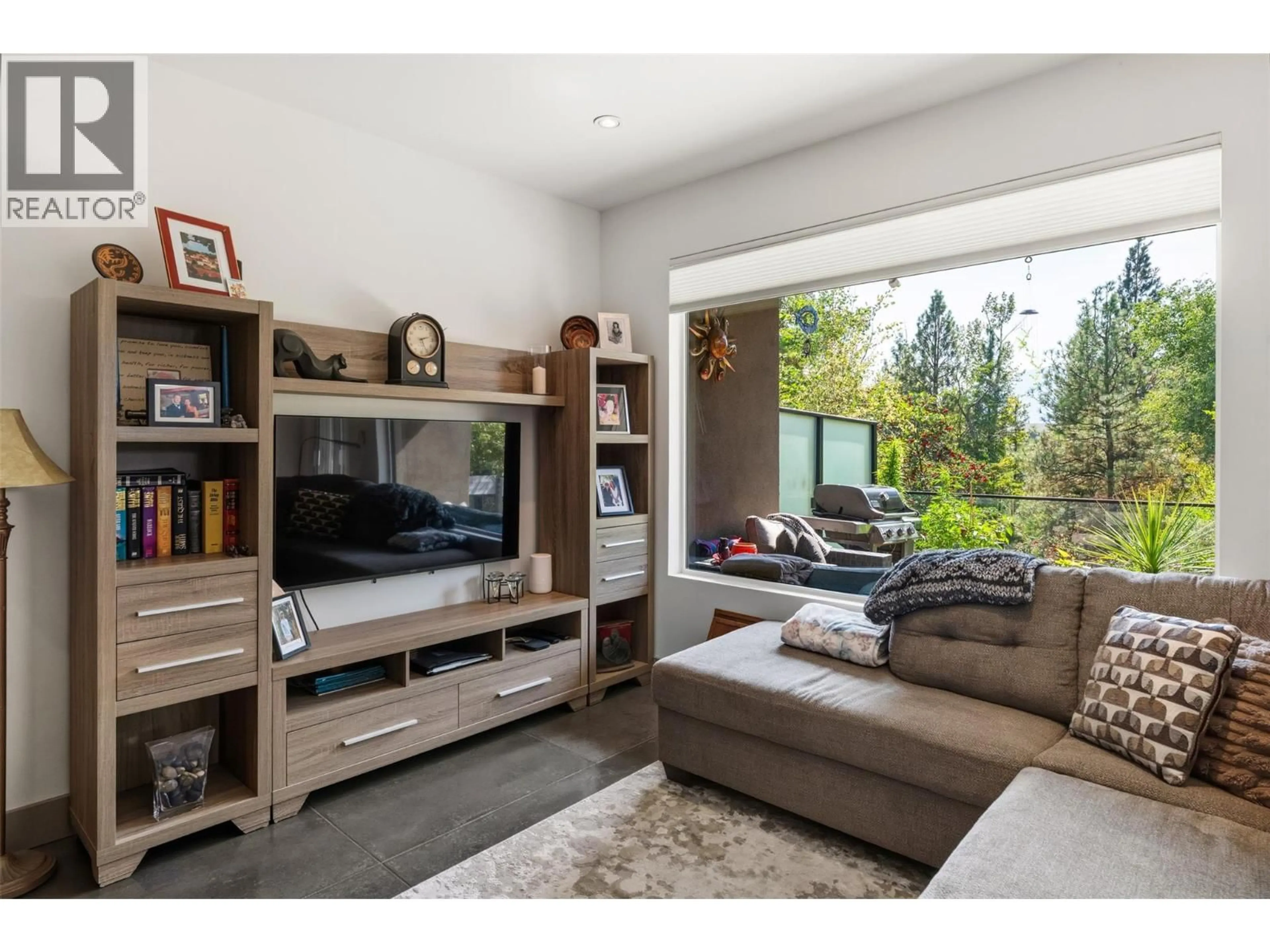 Living room with furniture, wood/laminate floor for 729 CREEKSIDE ROAD, Penticton British Columbia V2A2C5