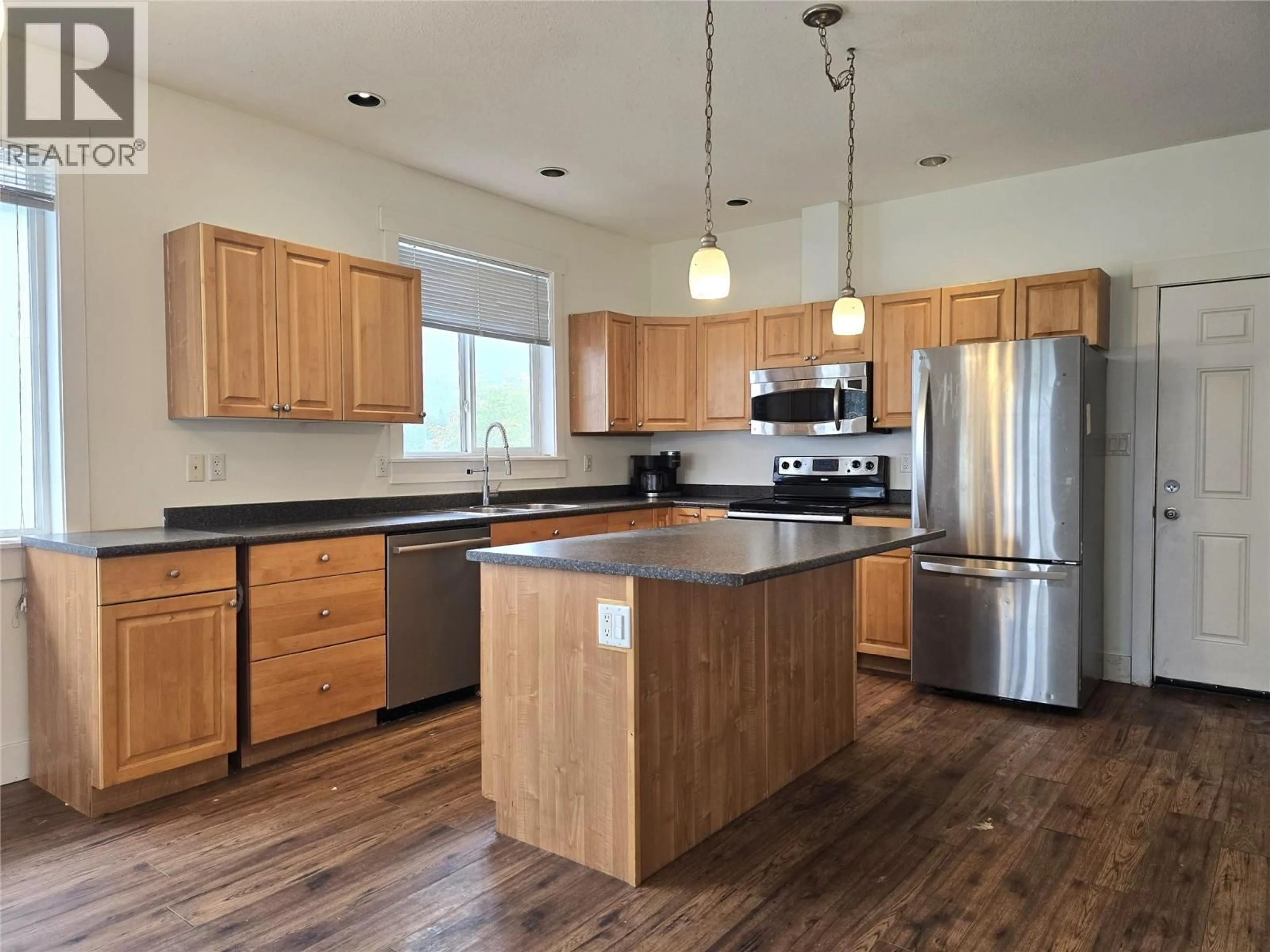 Open concept kitchen, wood/laminate floor for 197 24 HIGHWAY, Little Fort British Columbia V0E2C0