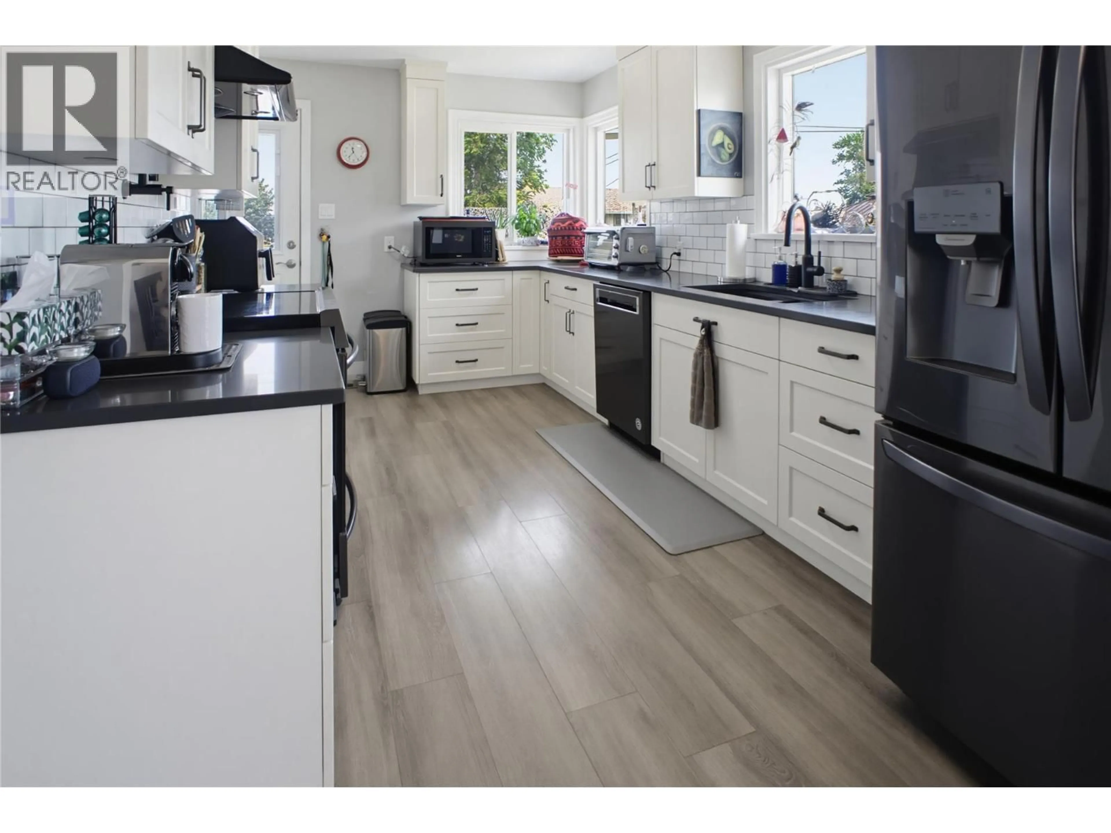 Open concept kitchen, wood/laminate floor for 220 PARK STREET, Kamloops British Columbia V2B4A7