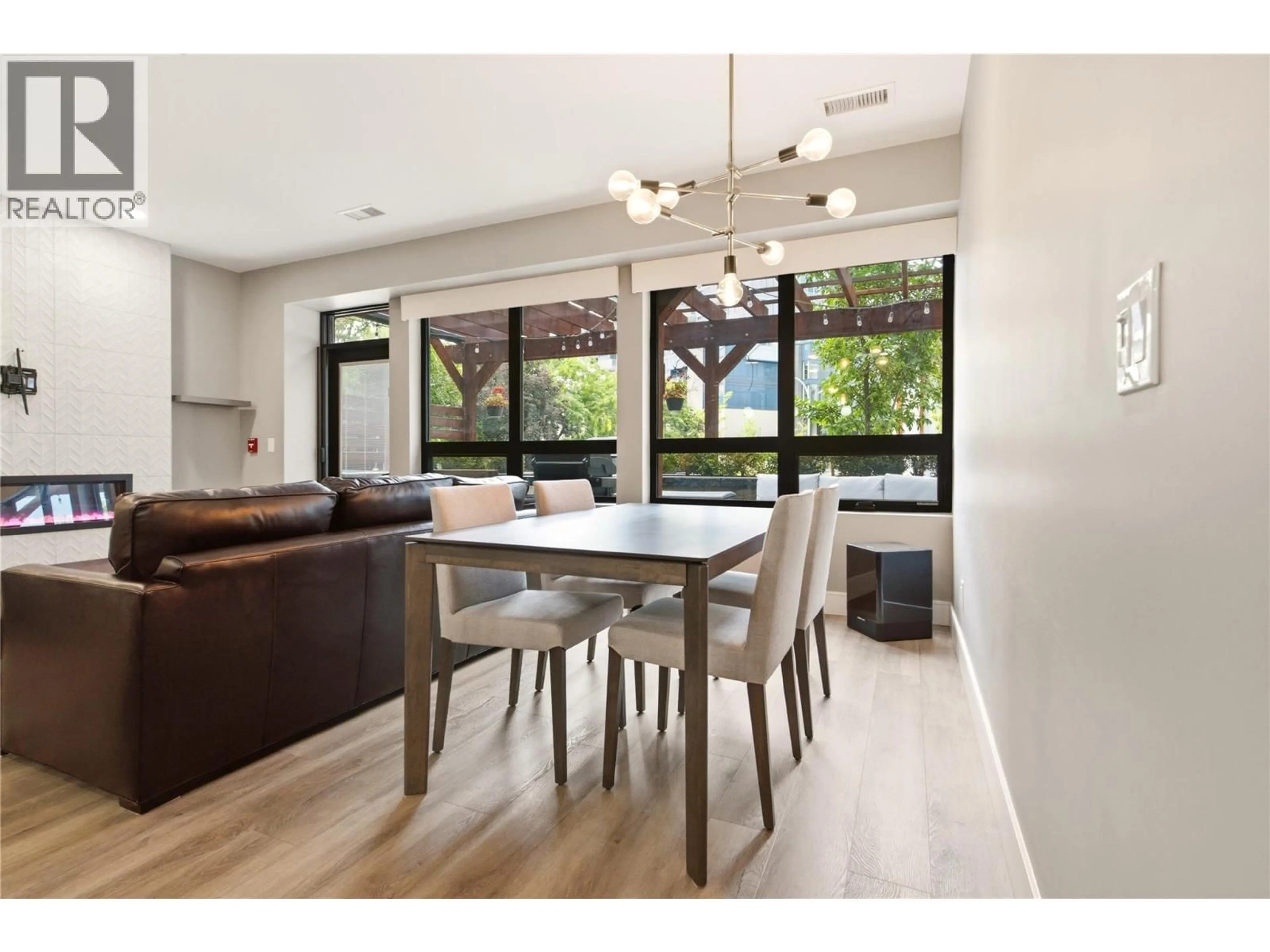 Dining room, wood/laminate floor for 103 - 529 TRUSWELL ROAD, Kelowna British Columbia V1W3K7