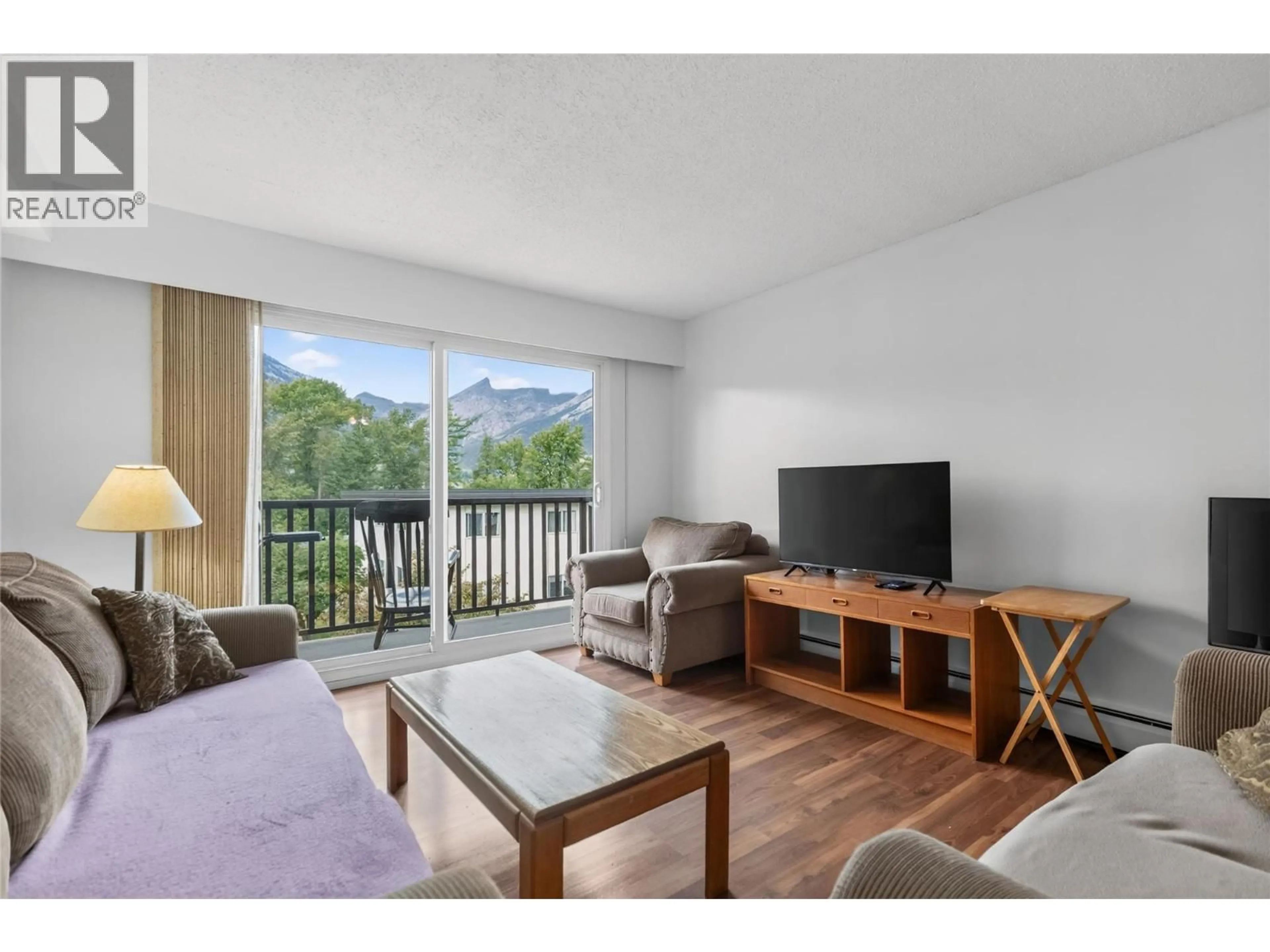 Living room with furniture, wood/laminate floor for 303 - 51 RIDGEMONT DRIVE, Fernie British Columbia V0B1M2
