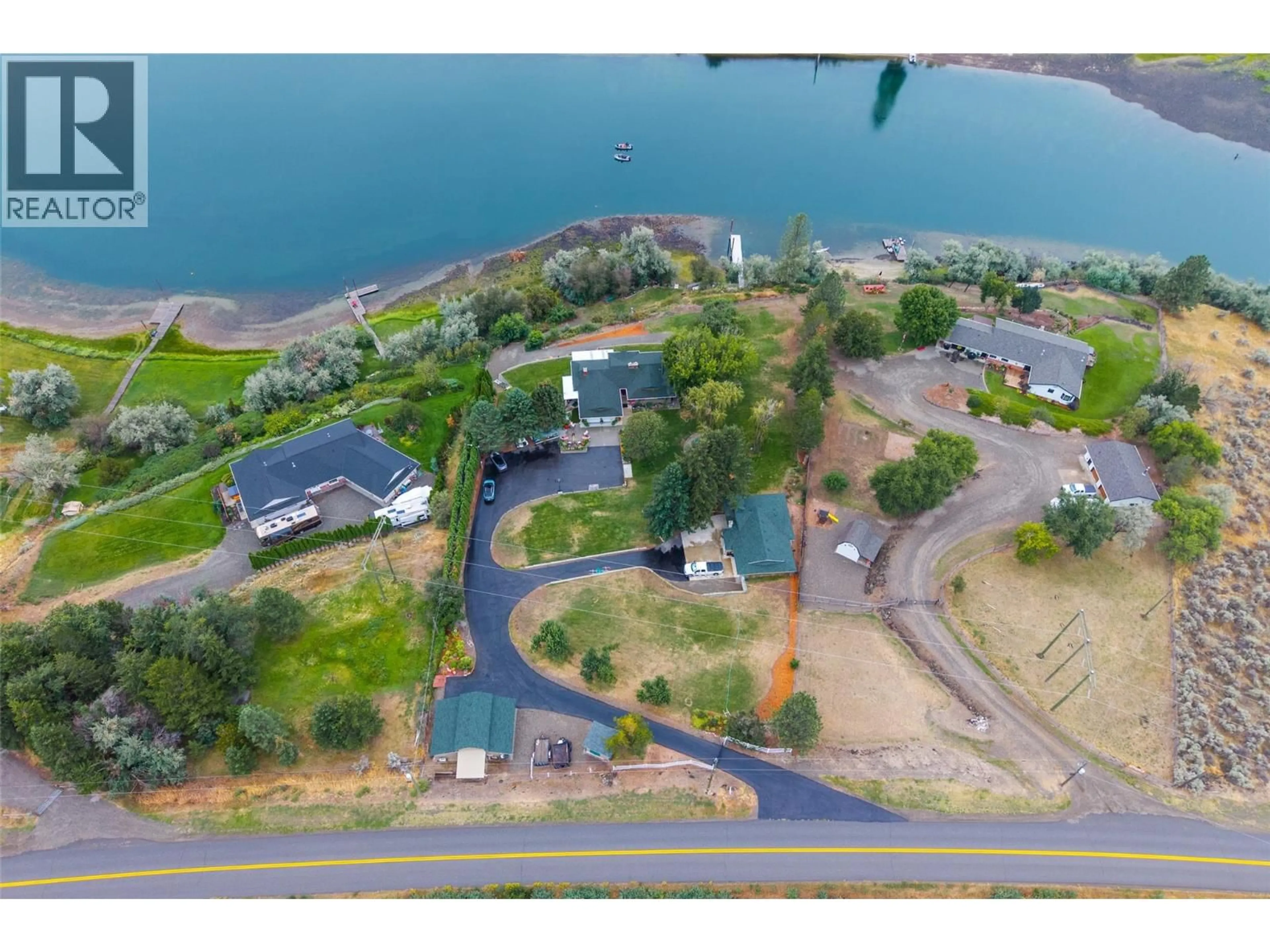 A pic from outside/outdoor area/front of a property/back of a property/a pic from drone, water/lake/river/ocean view for 3892 SHUSWAP ROAD EAST, Kamloops British Columbia V2H1S7