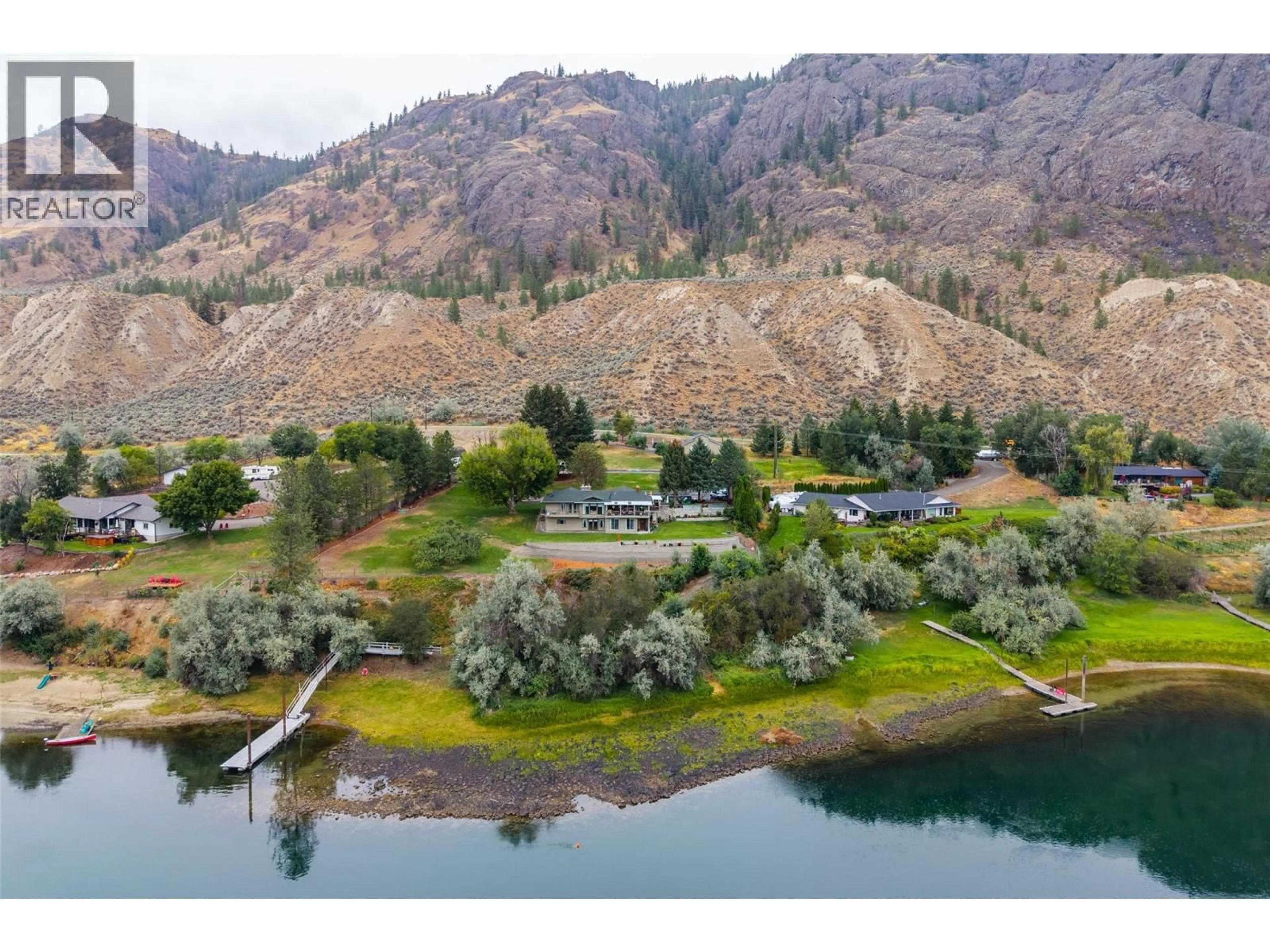 A pic from outside/outdoor area/front of a property/back of a property/a pic from drone, water/lake/river/ocean view for 3892 SHUSWAP ROAD EAST, Kamloops British Columbia V2H1S7