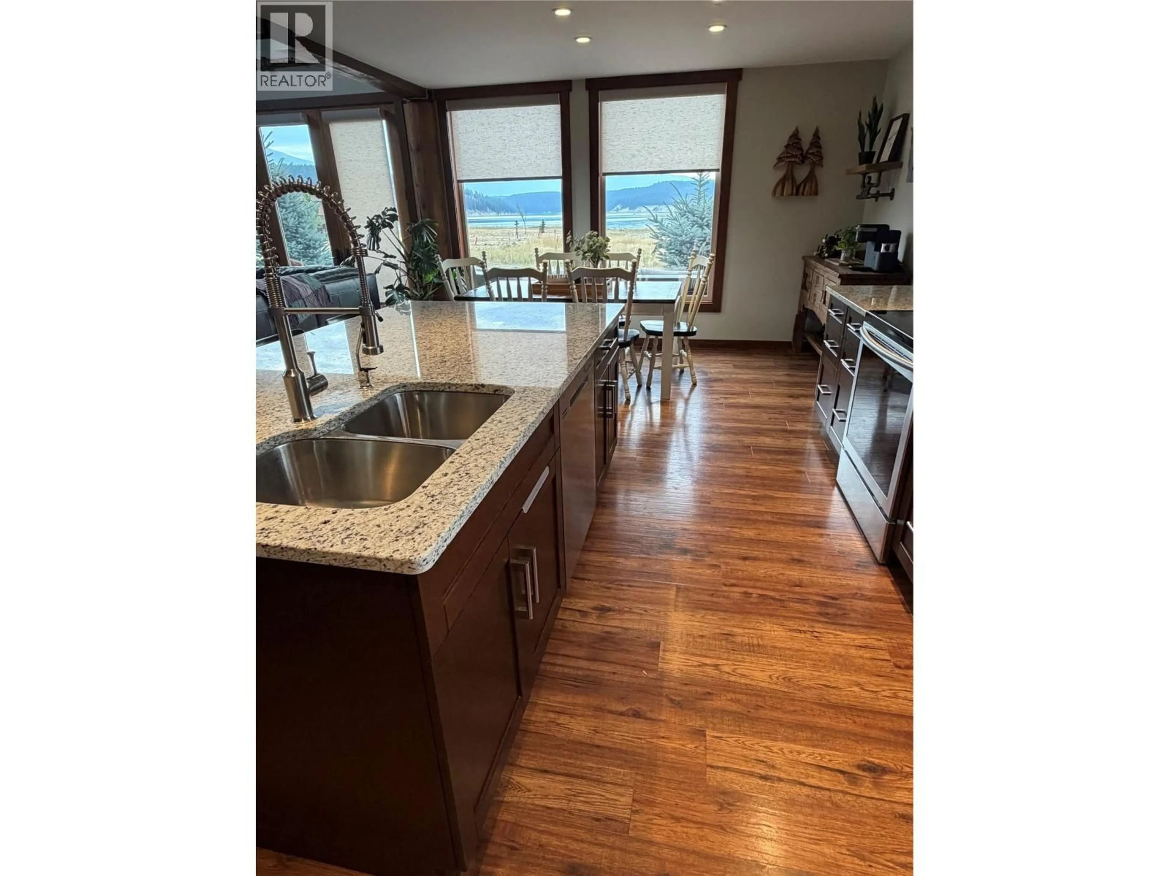 Open concept kitchen, wood/laminate floor for 1671 KOOCANUSA LAKE DRIVE, Koocanusa West British Columbia V0B1T4