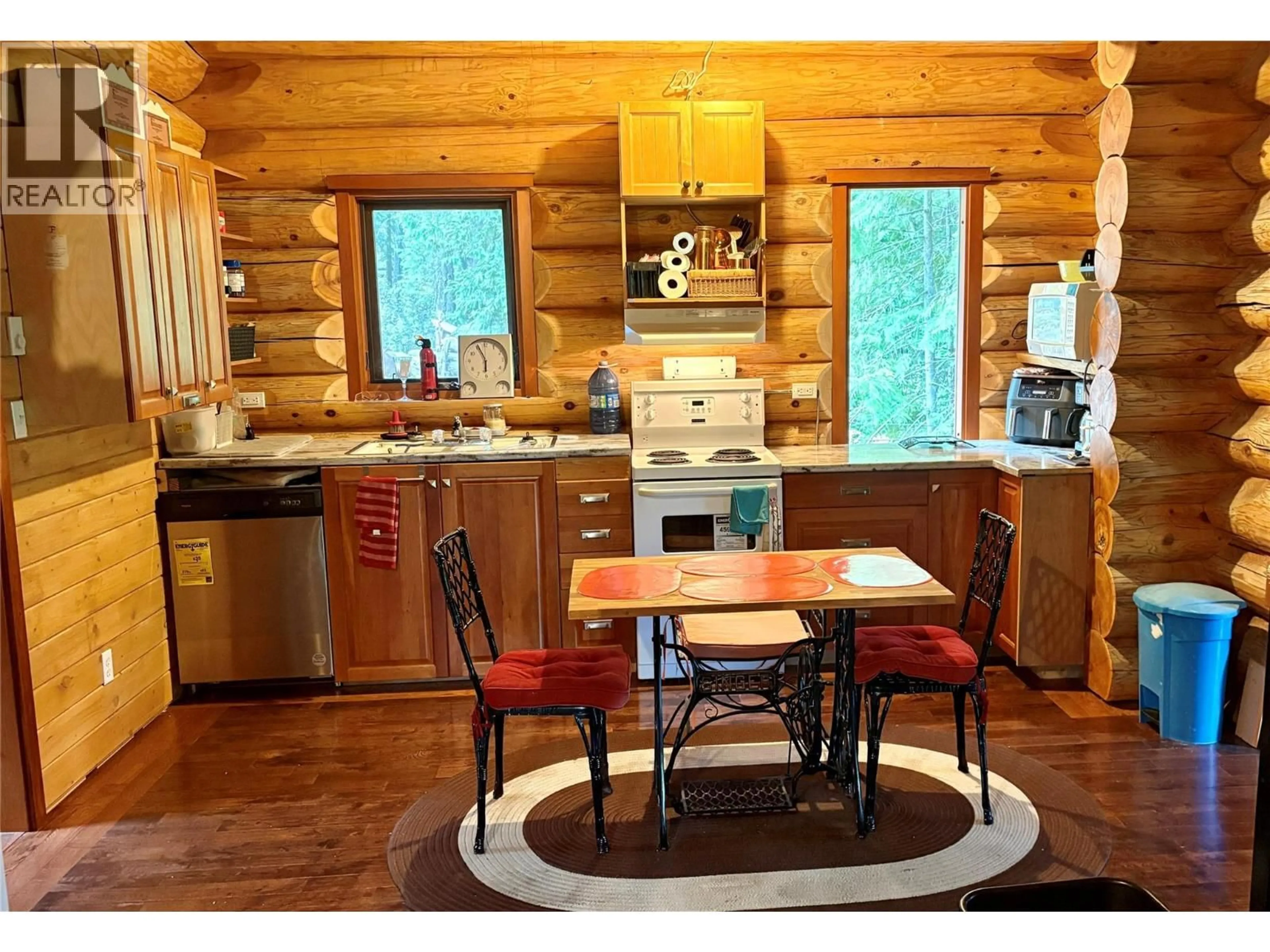 Rustic kitchen, wood/laminate floor for 879 LEWIS ROAD, Harrop British Columbia V1L6P7