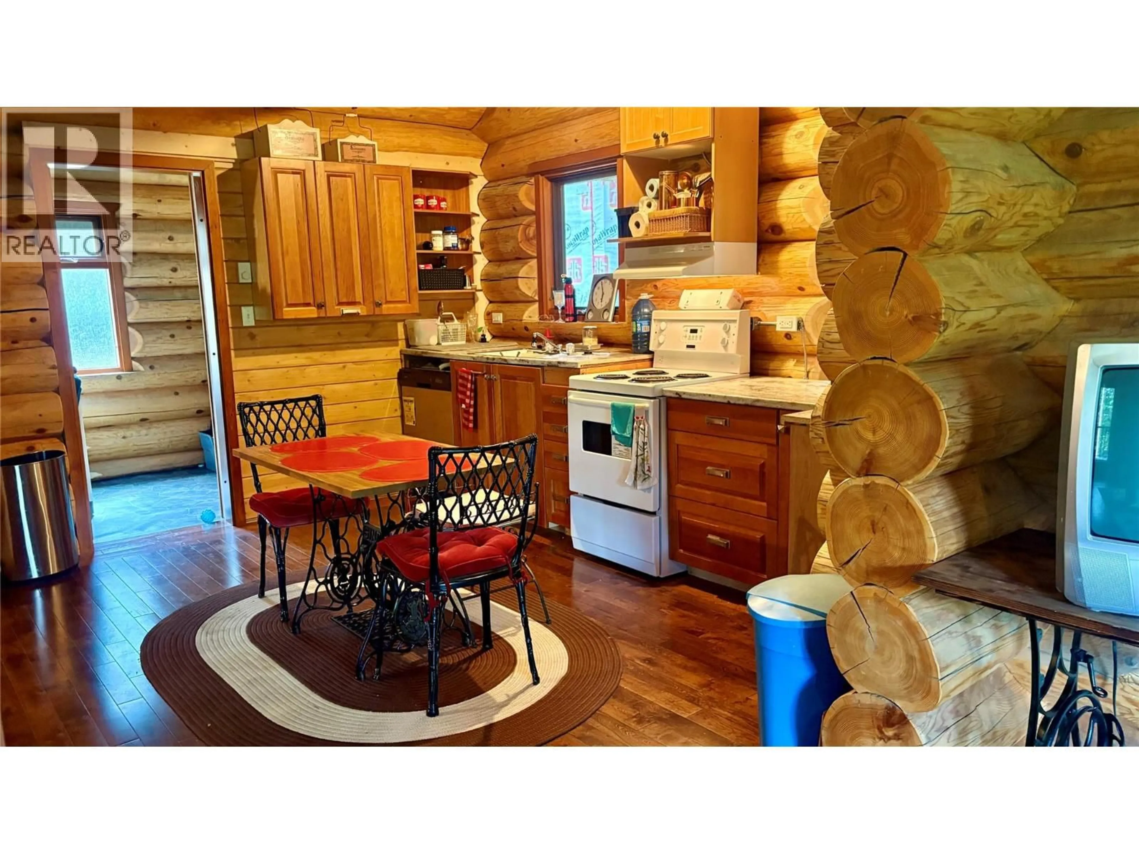 Rustic kitchen, wood/laminate floor for 879 LEWIS ROAD, Harrop British Columbia V1L6P7
