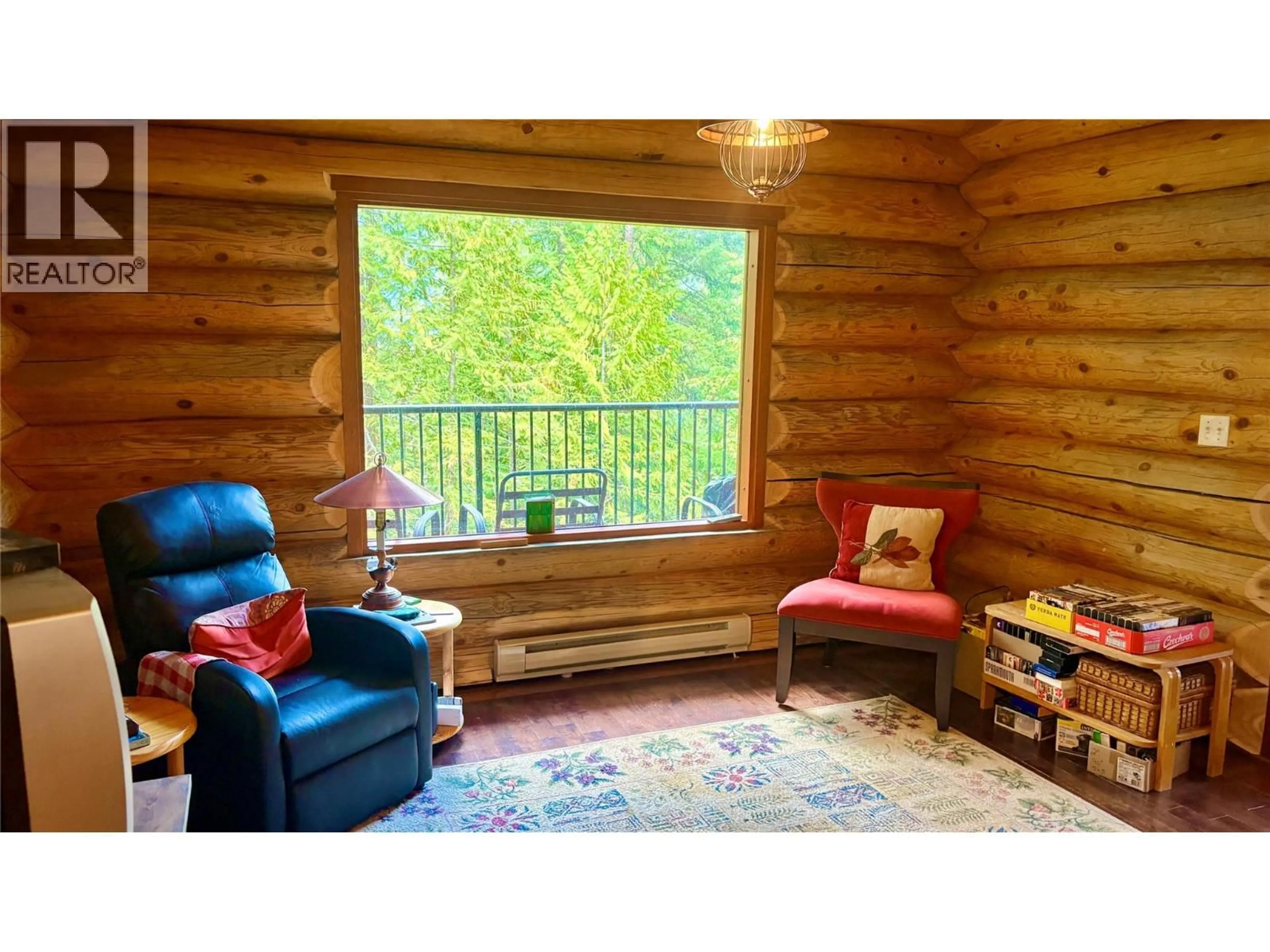Living room with furniture, wood/laminate floor for 879 LEWIS ROAD, Harrop British Columbia V1L6P7