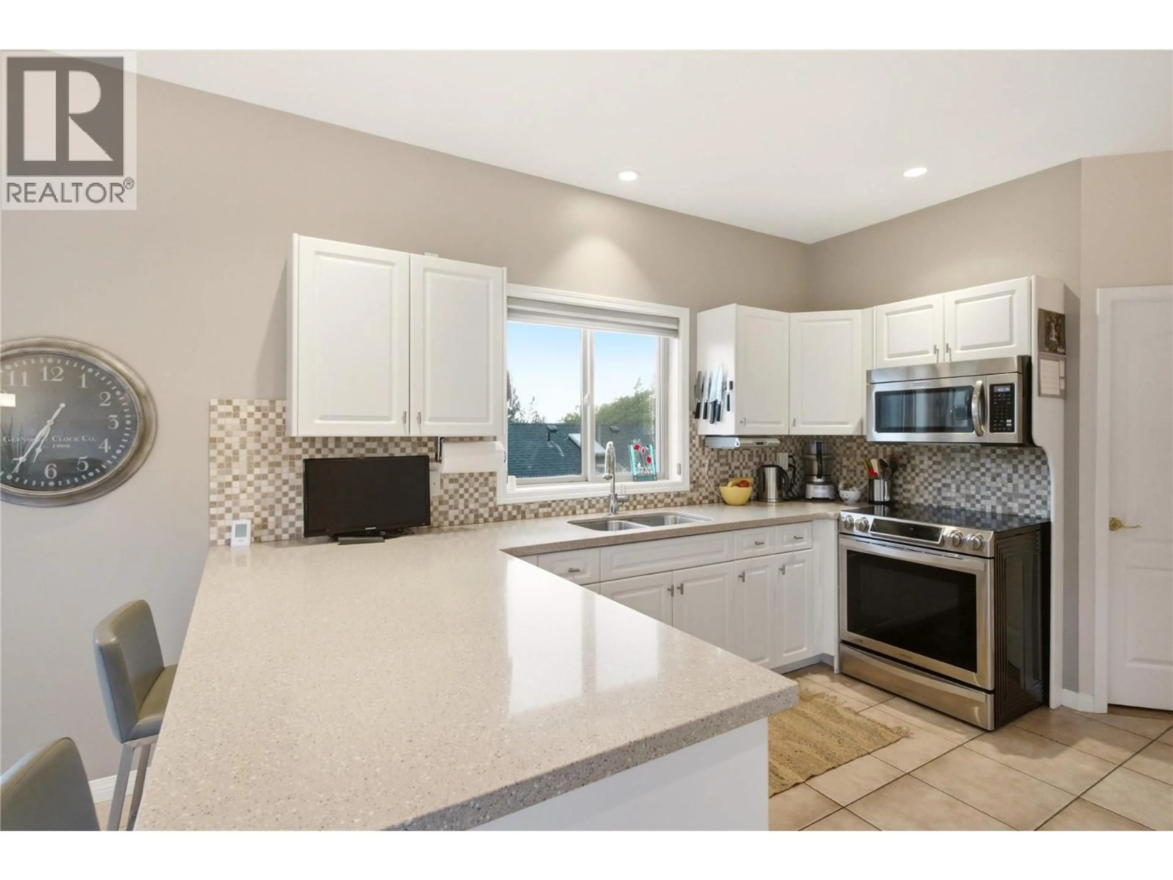 Open concept kitchen, ceramic/tile floor for 2201 LILLOOET CRESCENT, Kelowna British Columbia V1V1W3