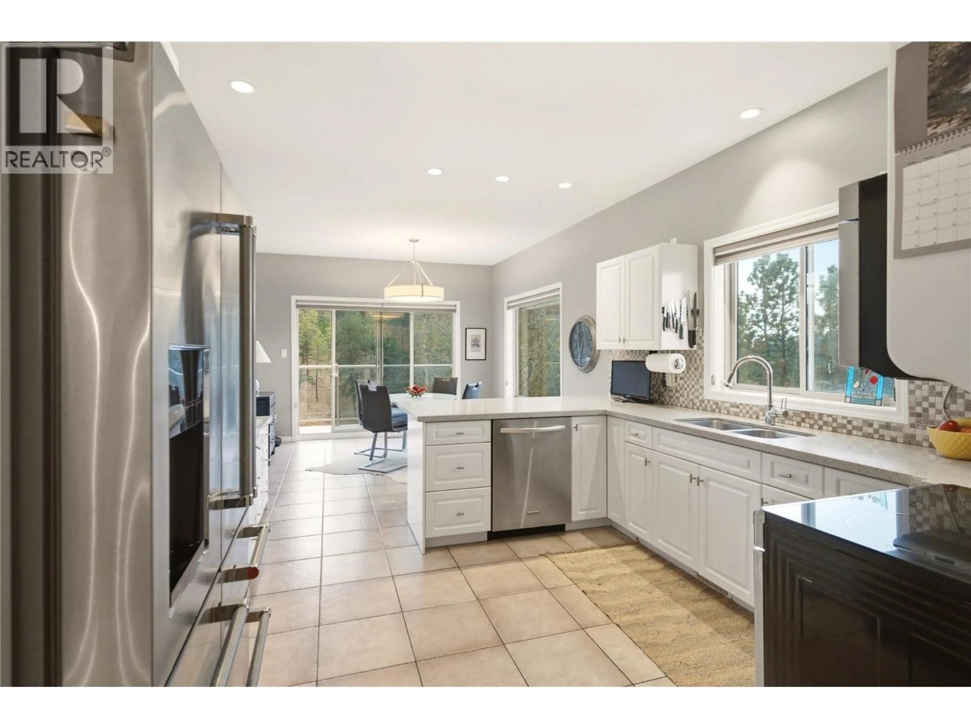 Open concept kitchen, ceramic/tile floor for 2201 LILLOOET CRESCENT, Kelowna British Columbia V1V1W3