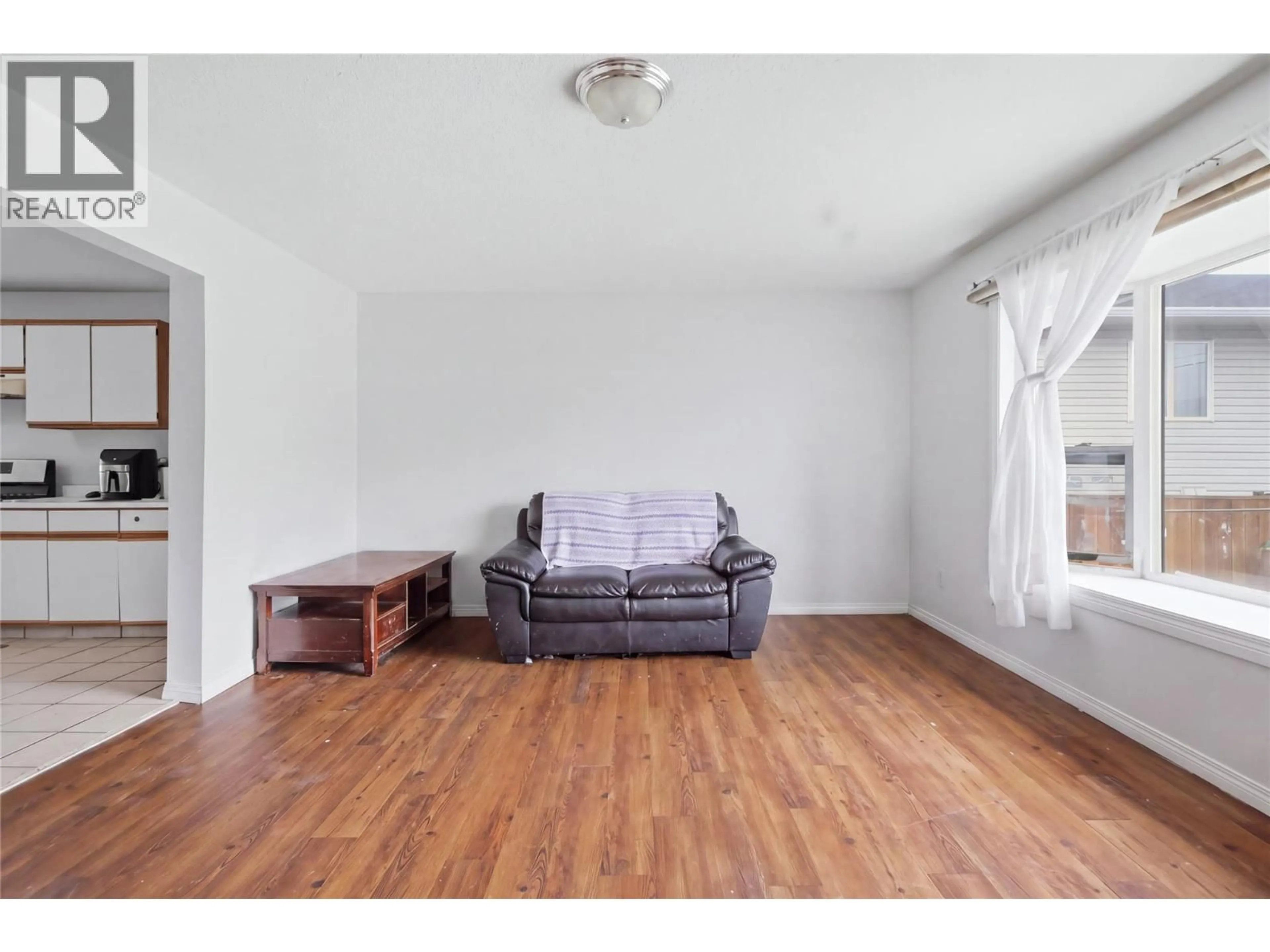 Living room with furniture, wood/laminate floor for 1636 TRANQUILLE ROAD, Kamloops British Columbia V2B3L4