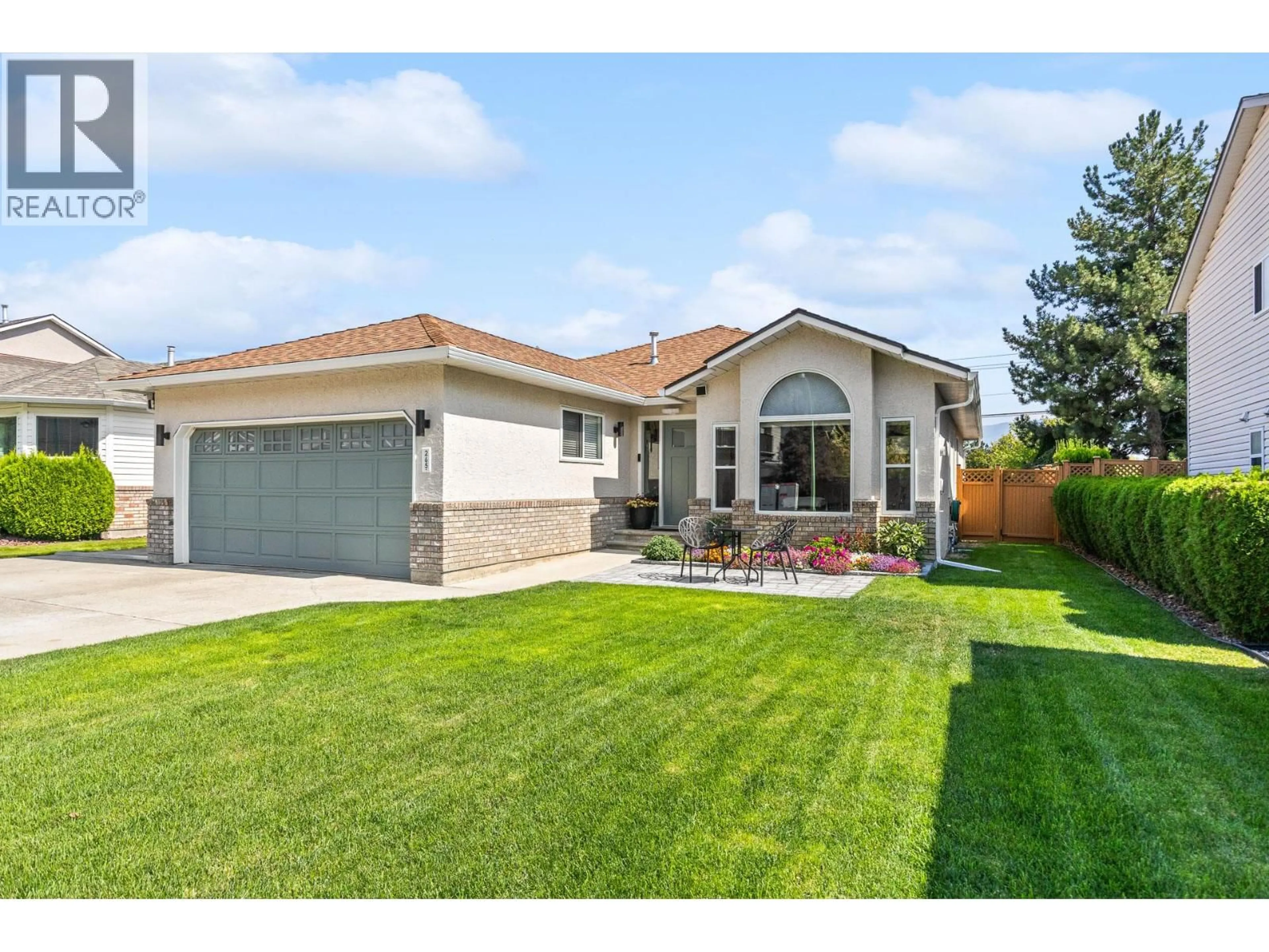 Home with vinyl exterior material, street for 265 RANCHLAND ROAD, Kelowna British Columbia V1V1T3