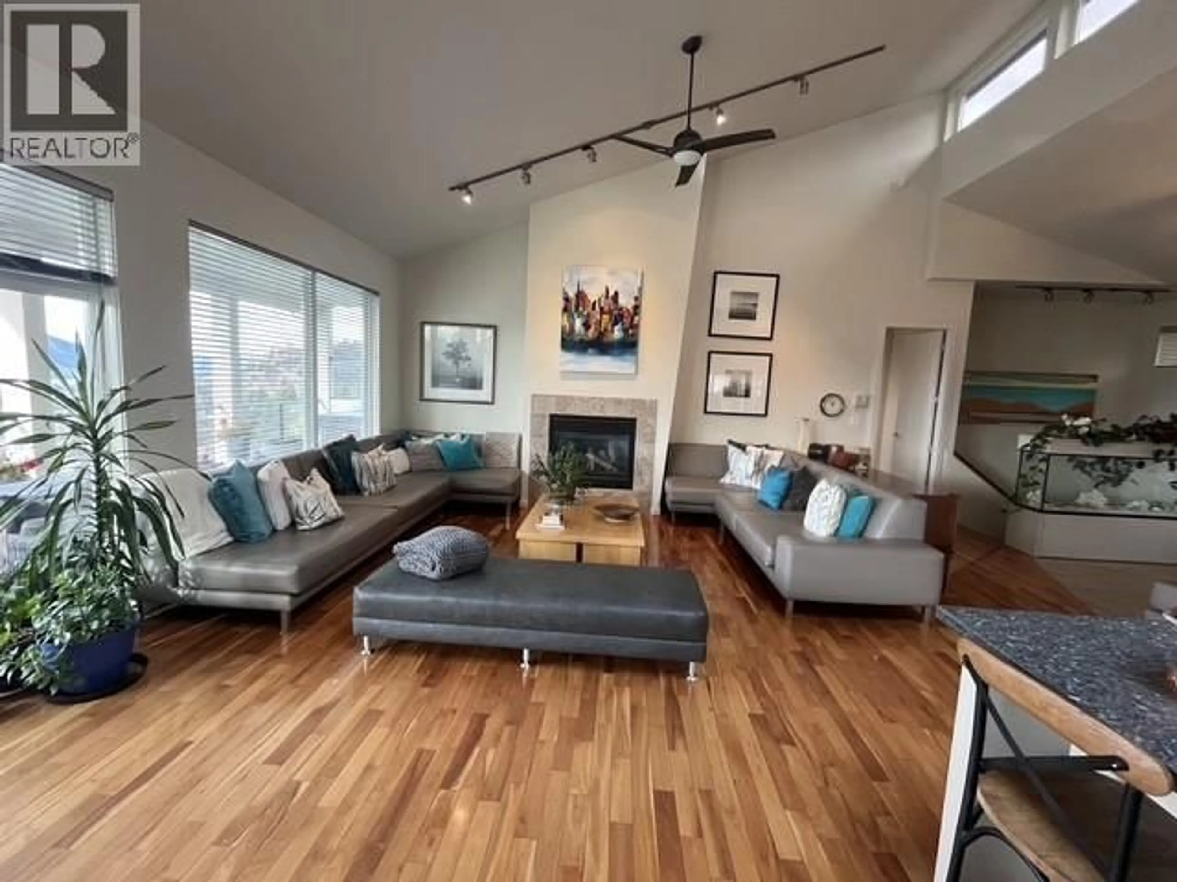 Living room with furniture, wood/laminate floor for 164 WILLIAMSON PLACE, Penticton British Columbia V2A8N1
