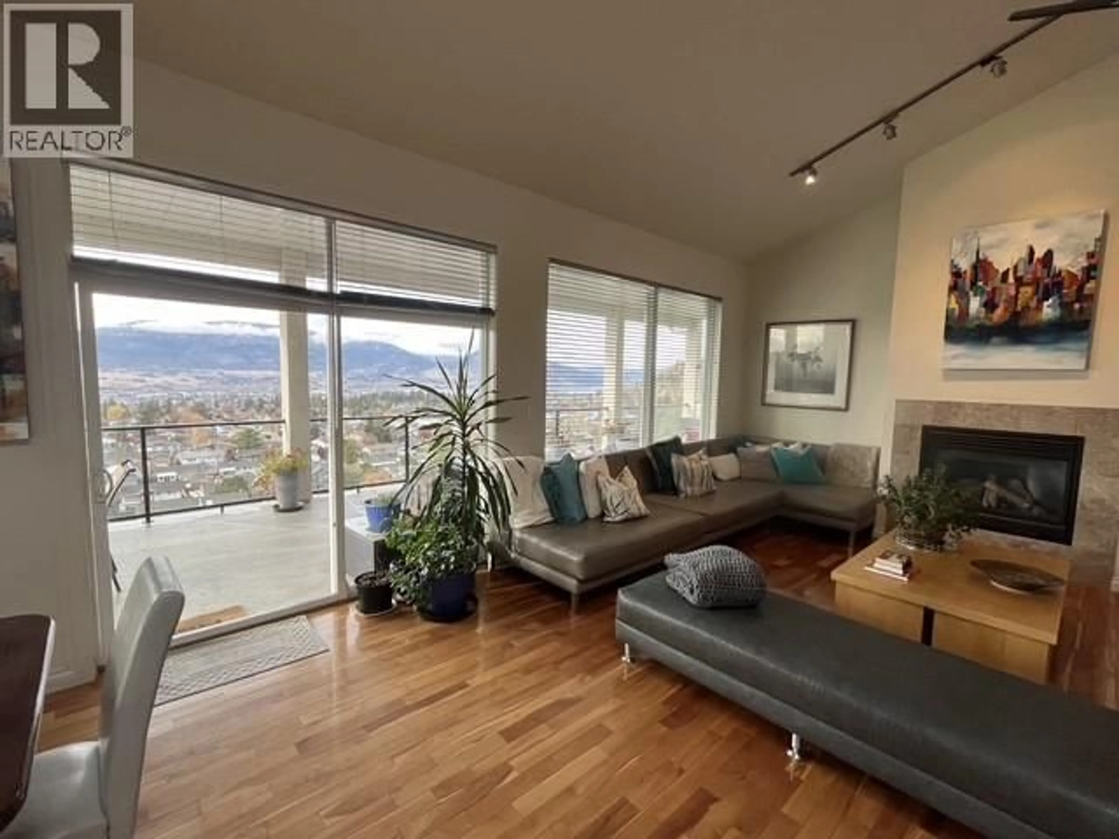 Living room with furniture, wood/laminate floor for 164 WILLIAMSON PLACE, Penticton British Columbia V2A8N1
